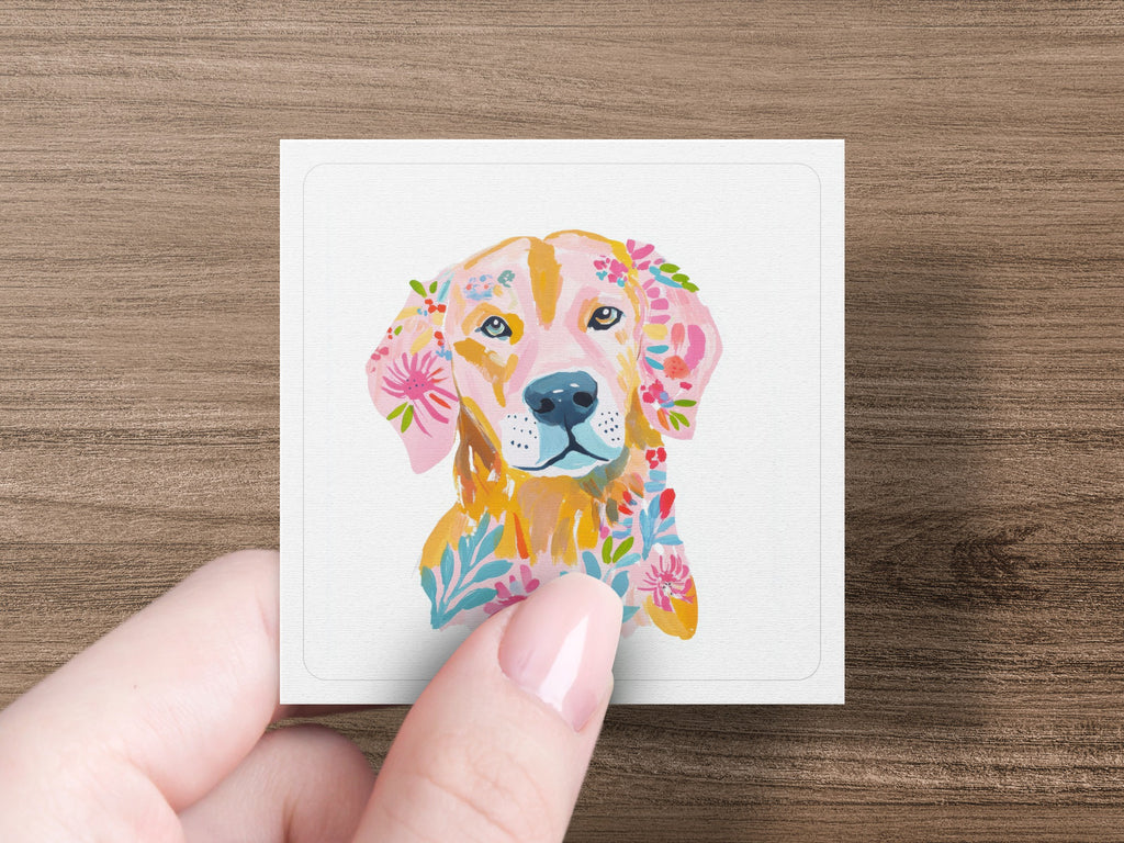 Golden Retriever with floral accents painted on a square card.