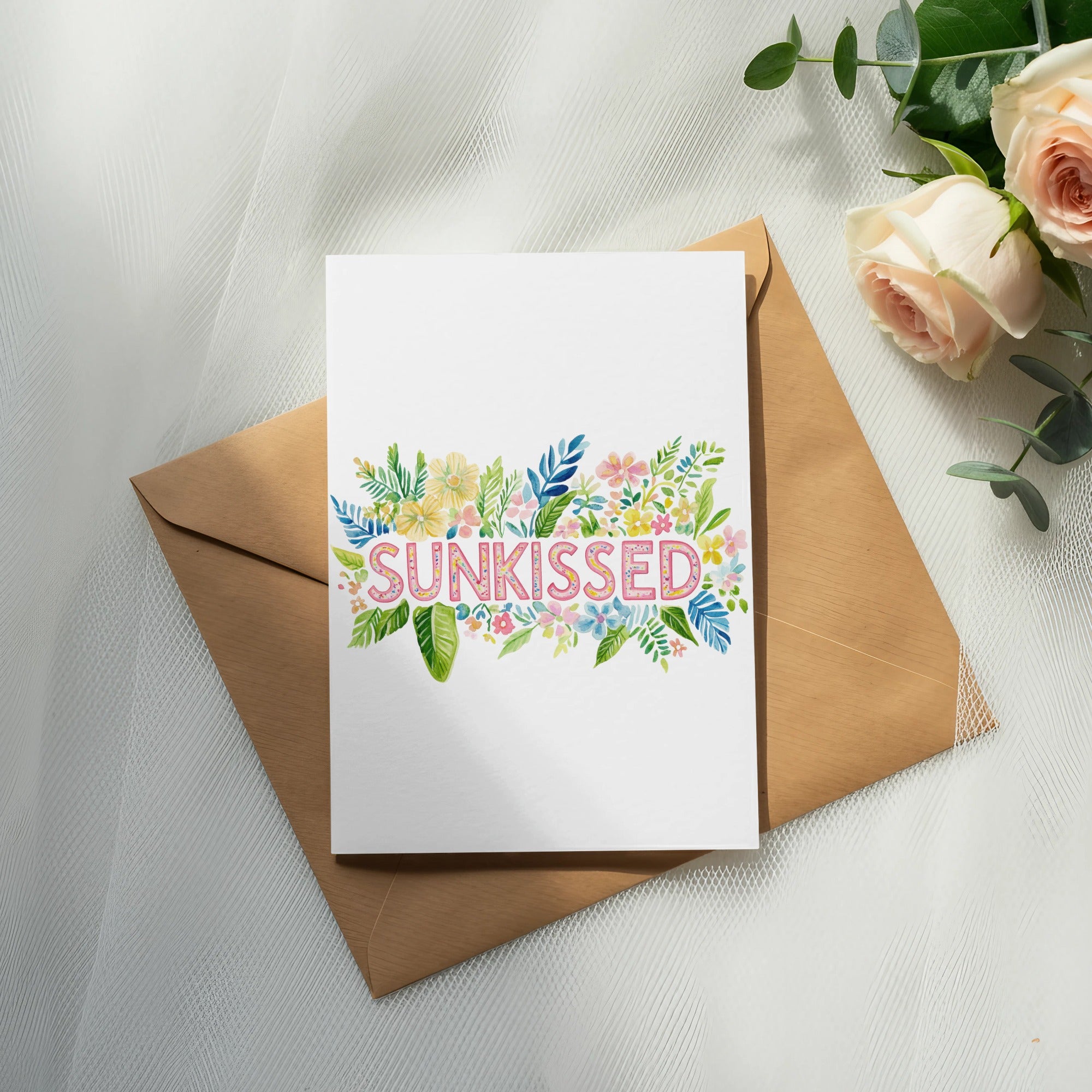 Card with "Sunkissed" in floral lettering on a brown envelope.