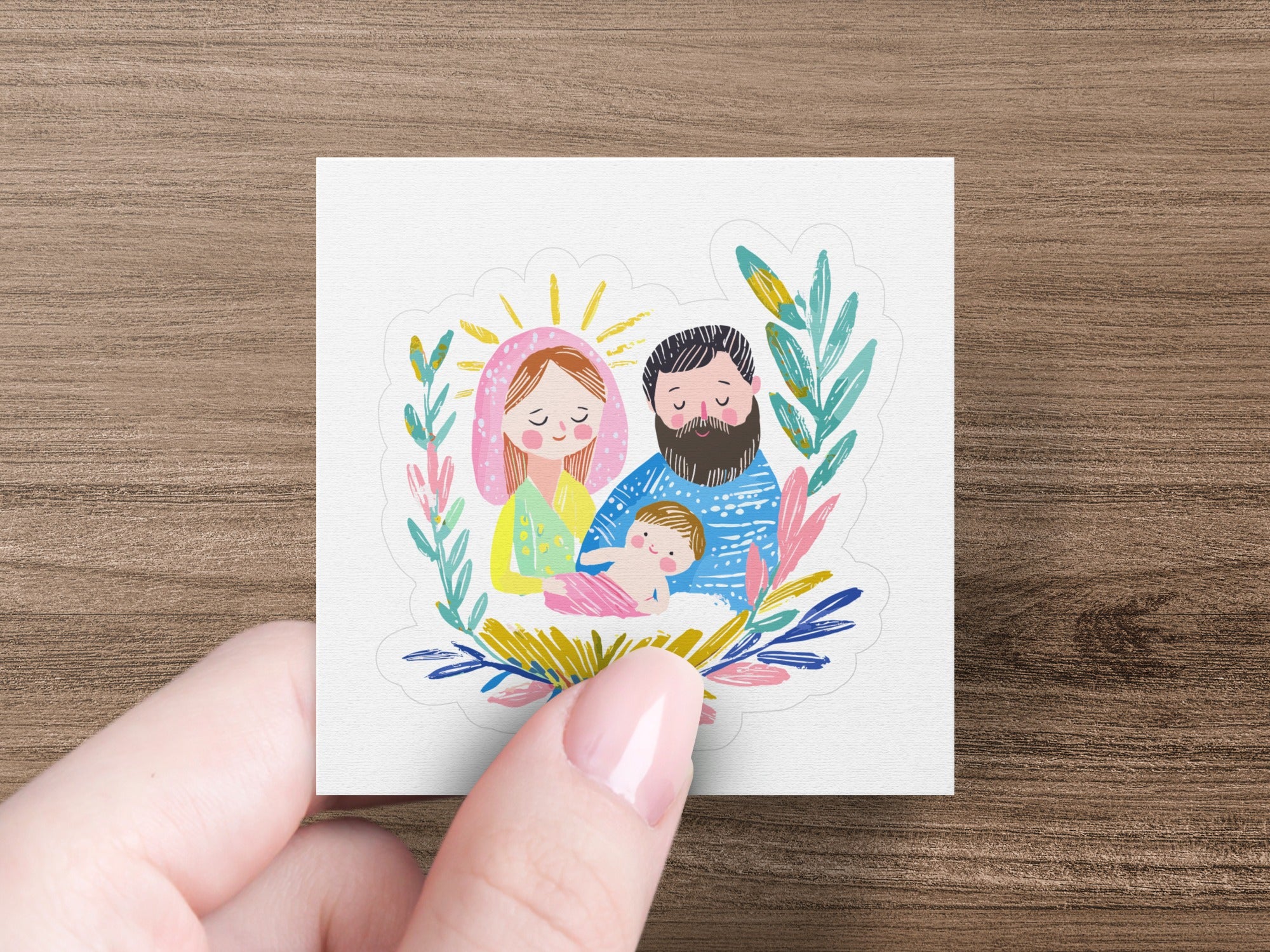 Religious illustration of Mary, Joseph, and baby Jesus with floral accents.