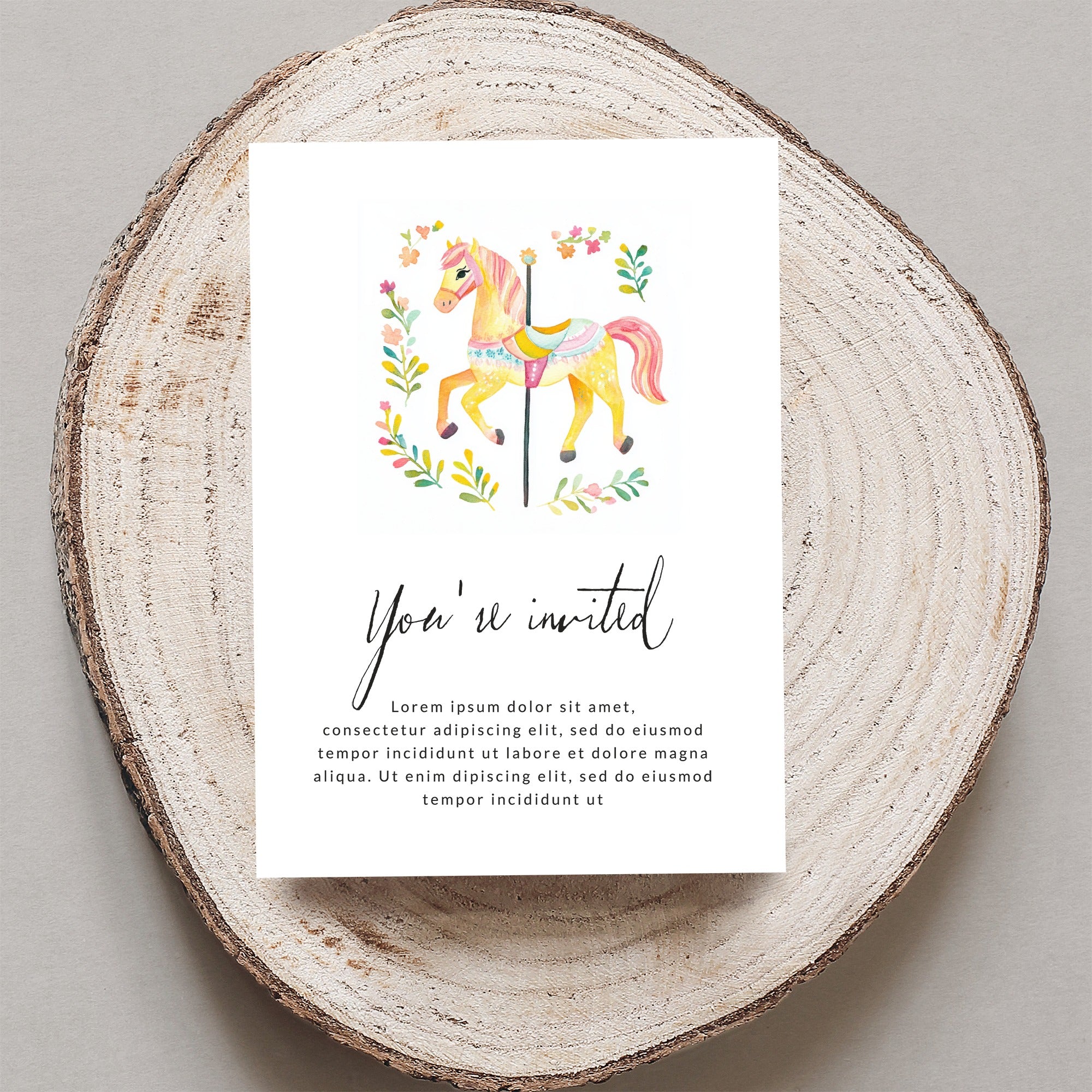 Carousel horse invitation with floral accents and placeholder text.
