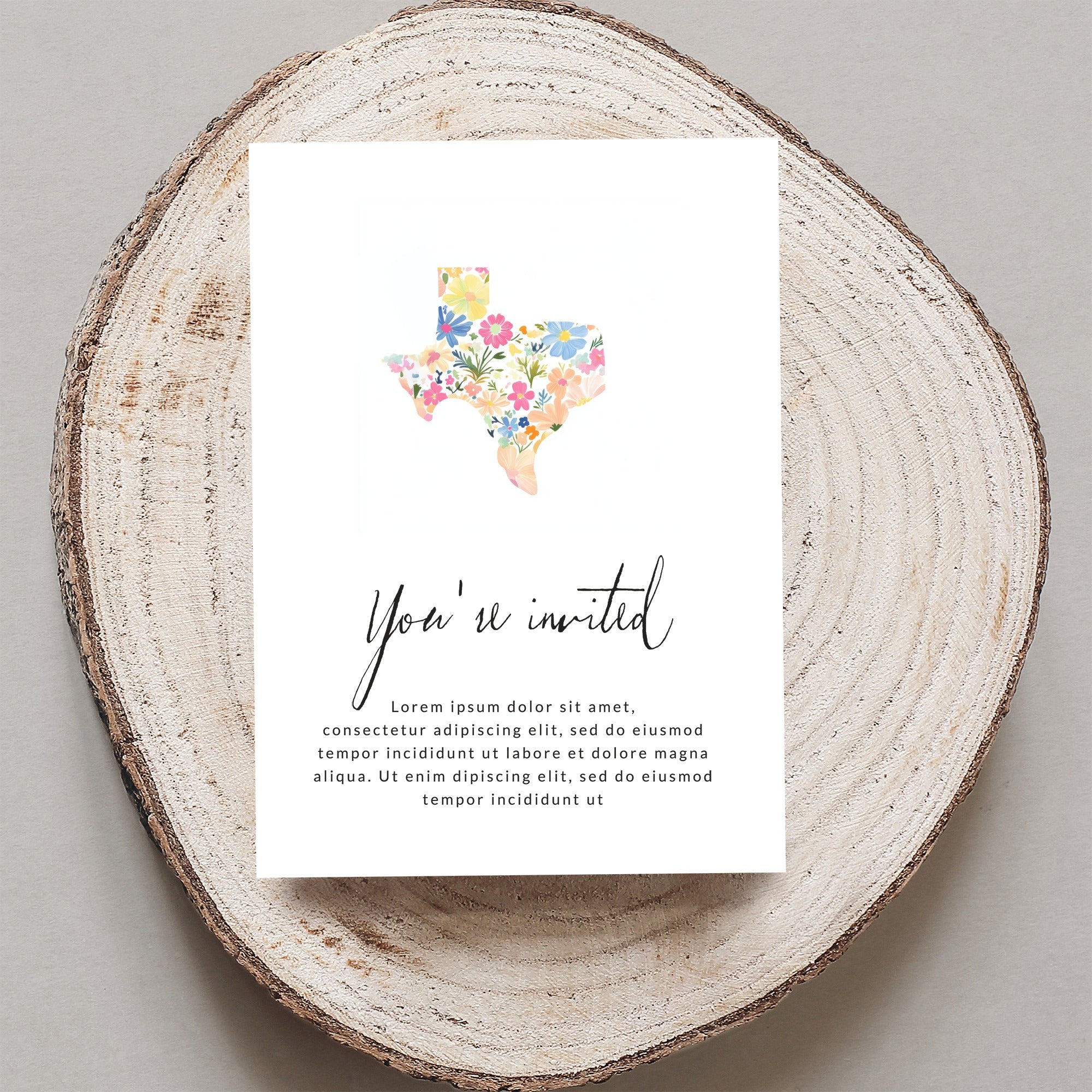 Texas shape invitation with floral pattern and placeholder text.