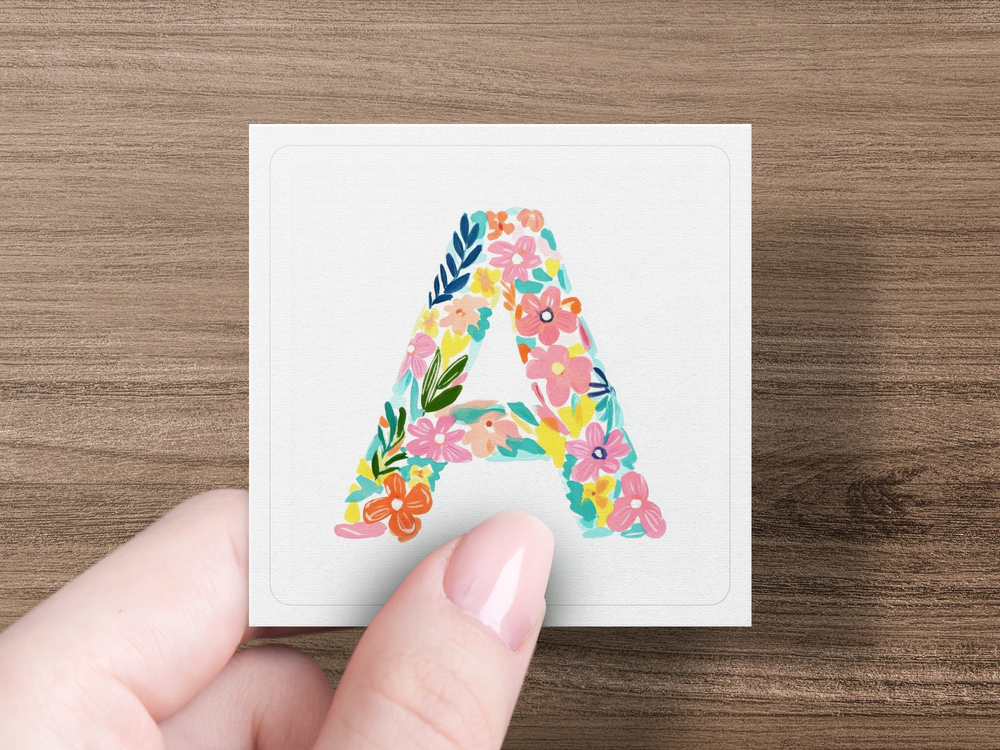 Letter A decorated with colorful floral pattern.