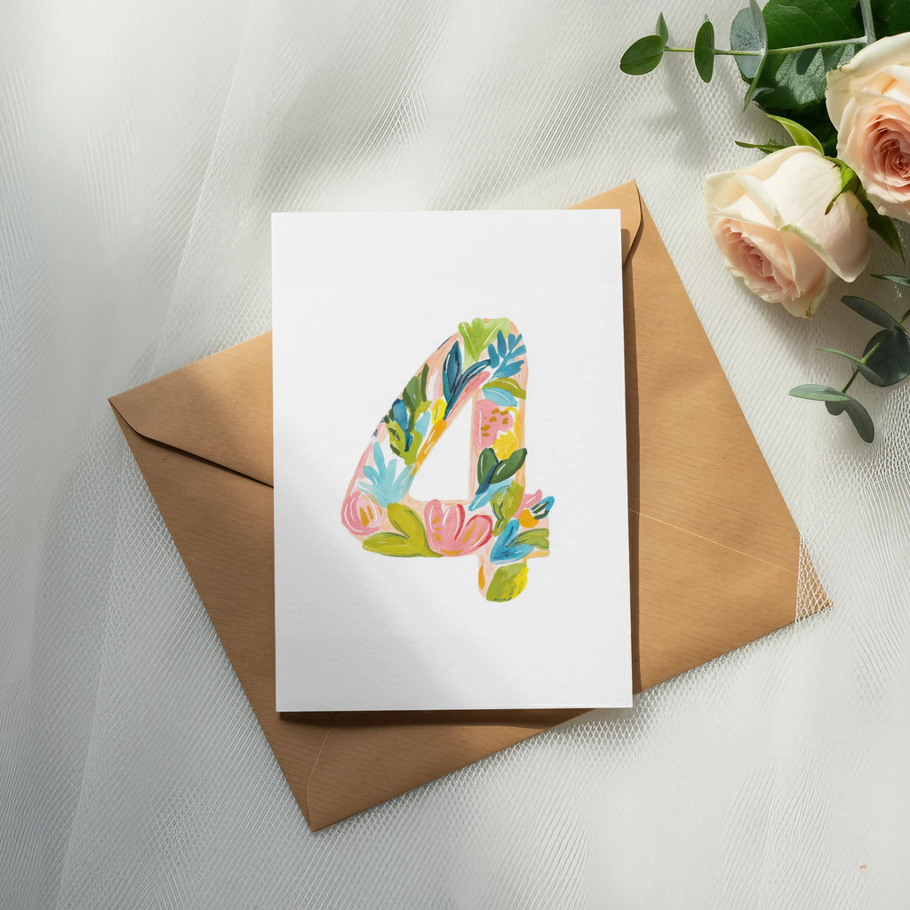 White card with floral number 4 design on brown envelope with roses.