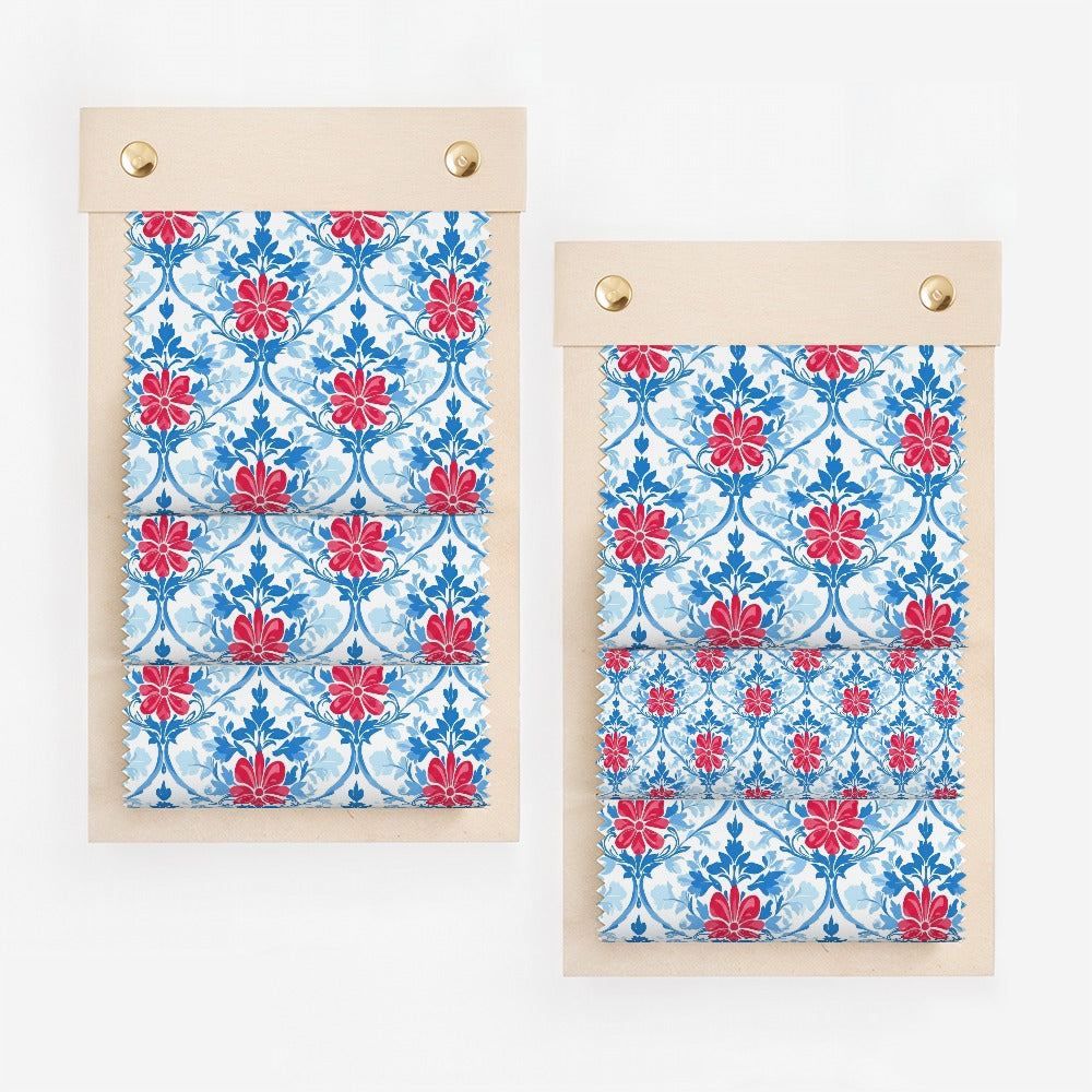 Two fabric swatches with red floral pattern on blue background.