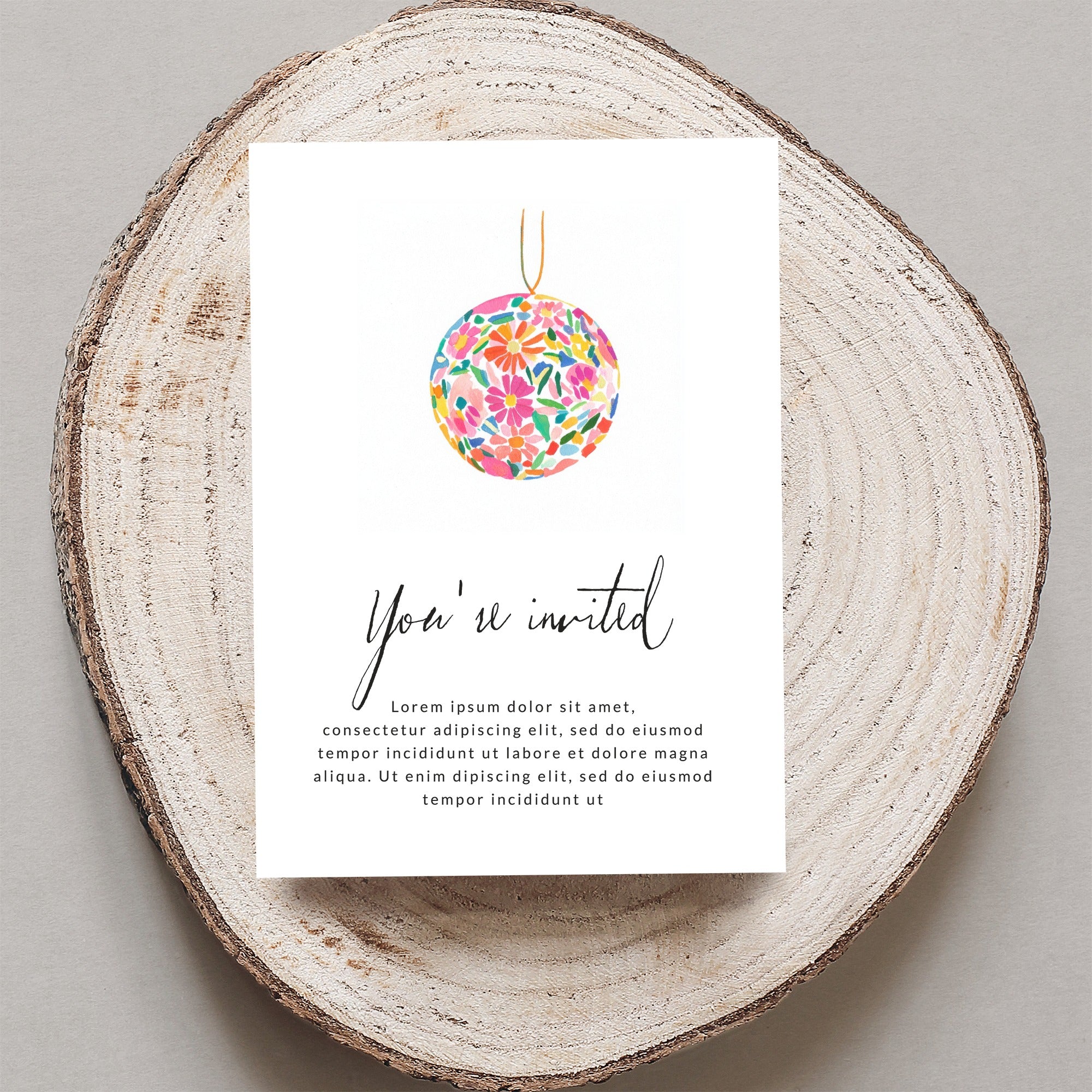 Invitation card with floral ornament and placeholder text.