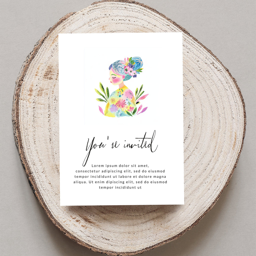 Invitation card with "You're invited" text and floral illustration on wood.