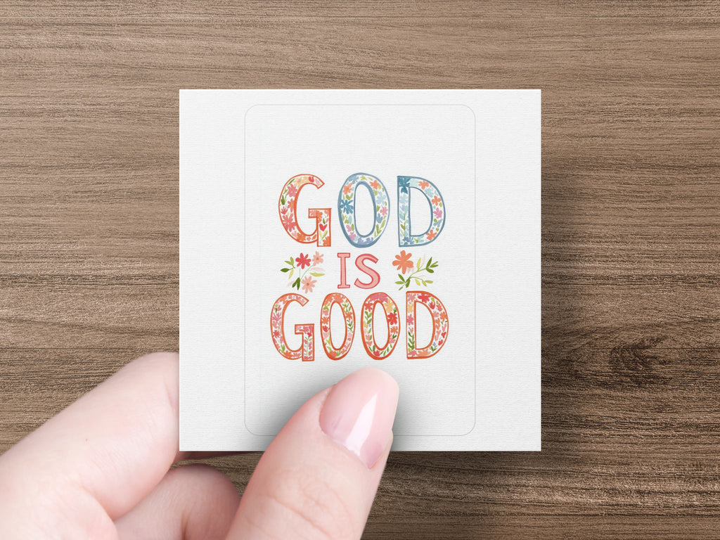 Square sticker with "GOD IS GOOD" text in colorful floral lettering.