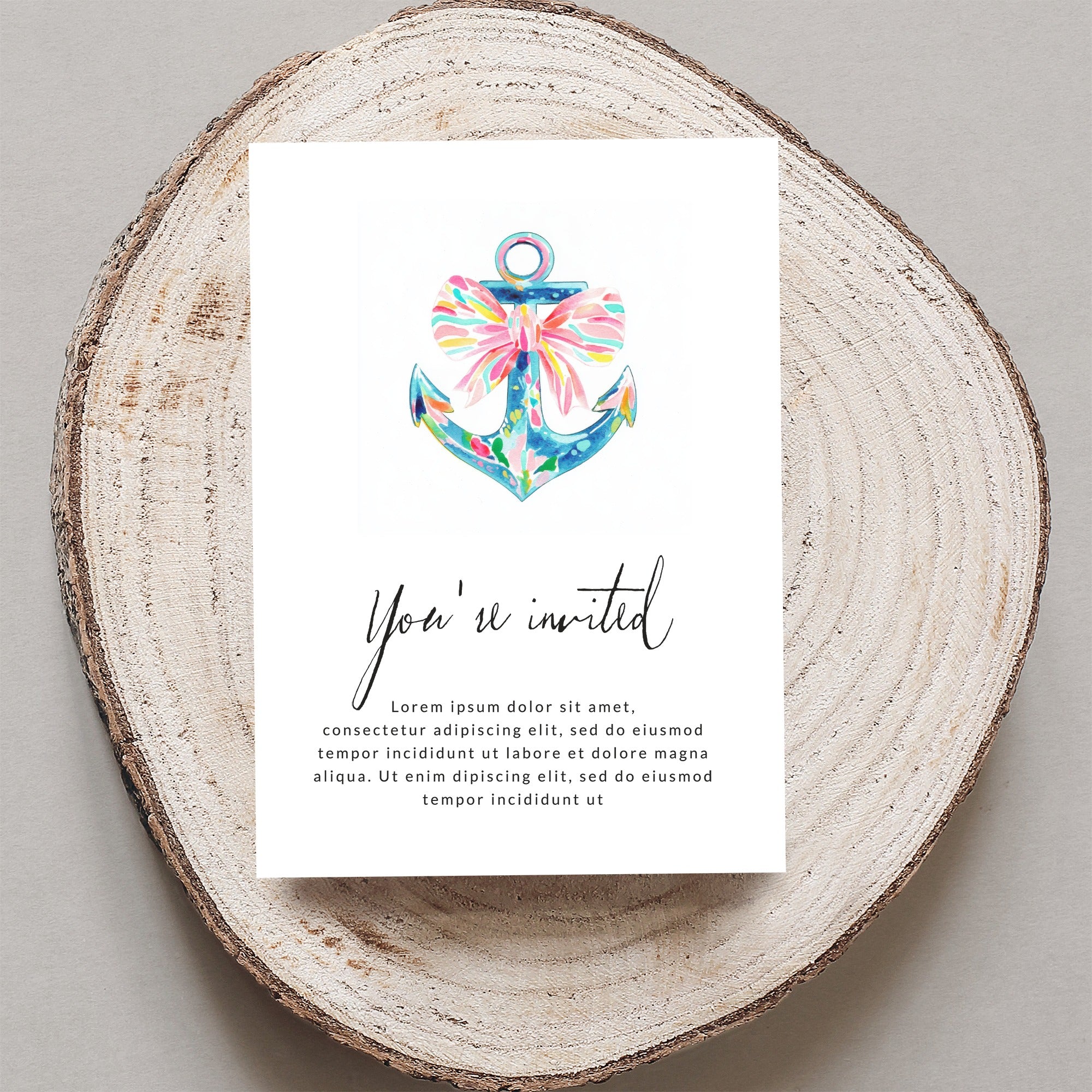 Watercolor anchor with ribbon on invitation: "You're invited" and placeholder text.