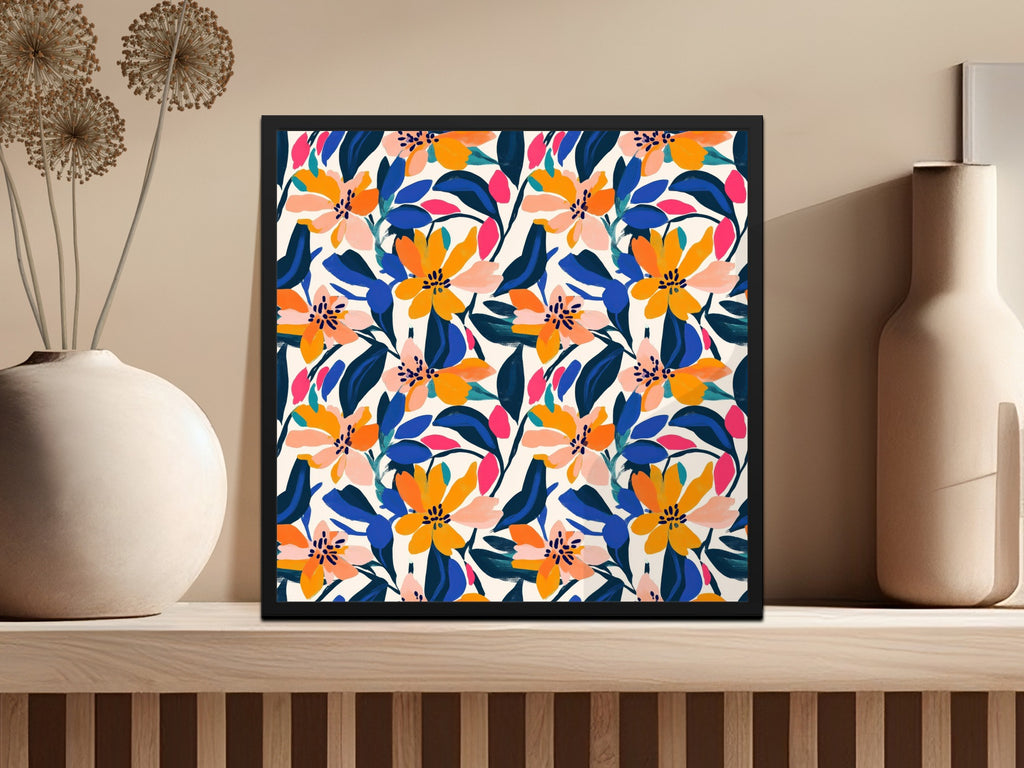 Framed artwork with a vibrant floral pattern on a shelf.