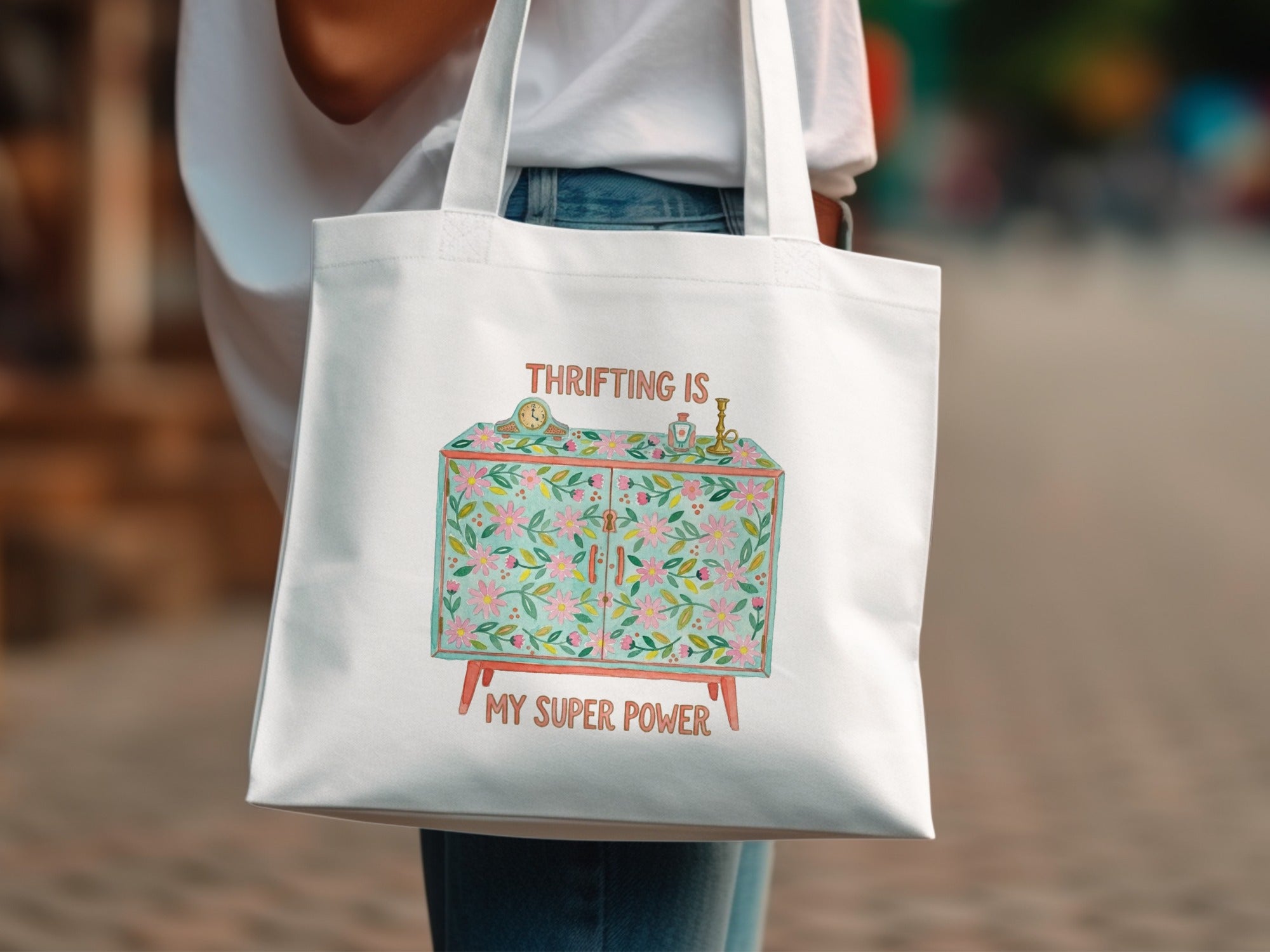 White tote bag with a cabinet illustration and "Thrifting is my super power" text.