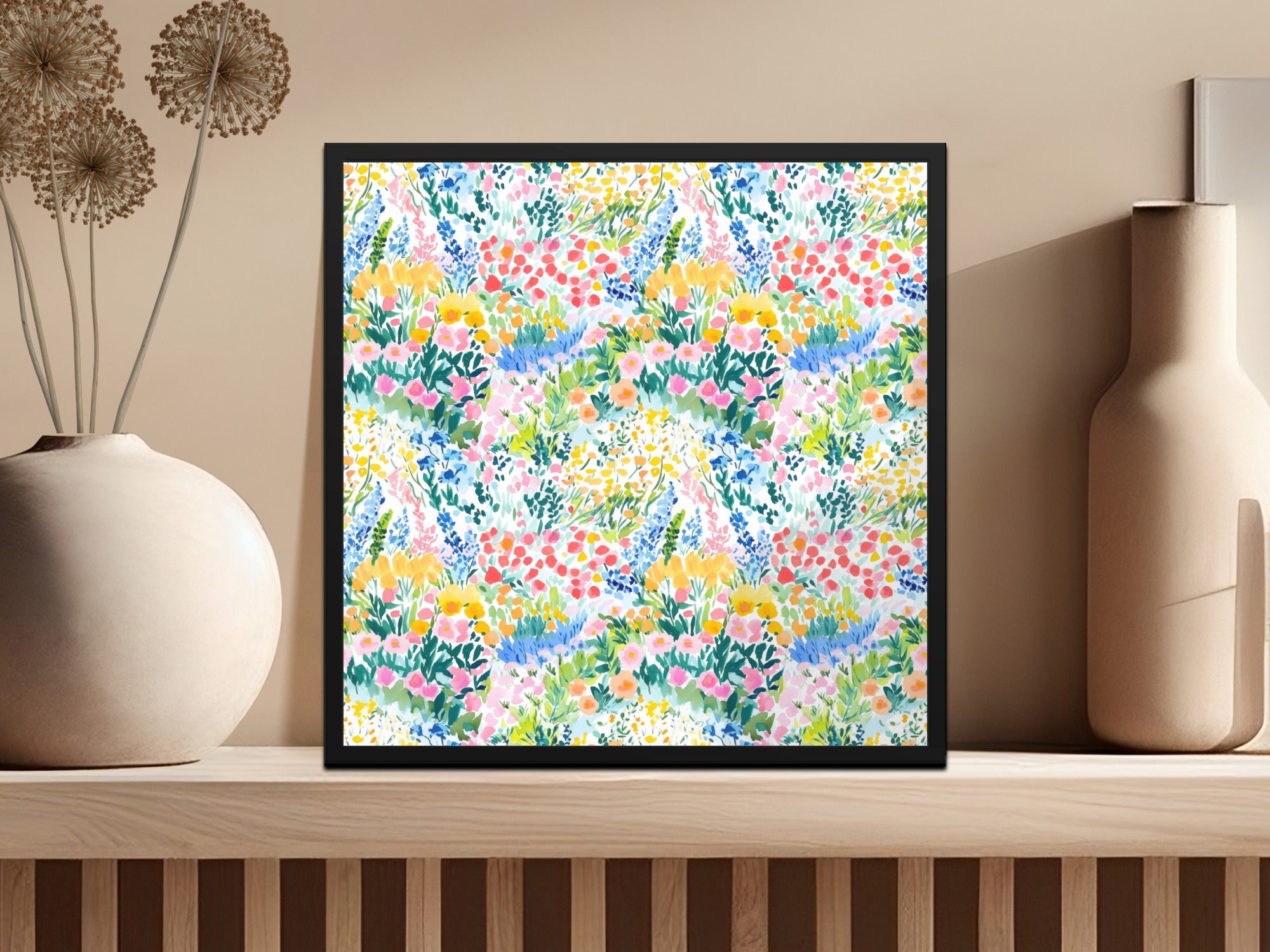 Framed watercolor floral print with red, blue, yellow, and green blossoms.