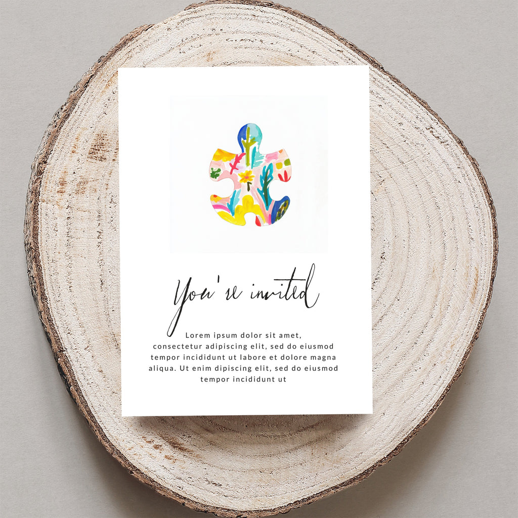 Invitation with colorful puzzle piece design and "You're invited" text.
