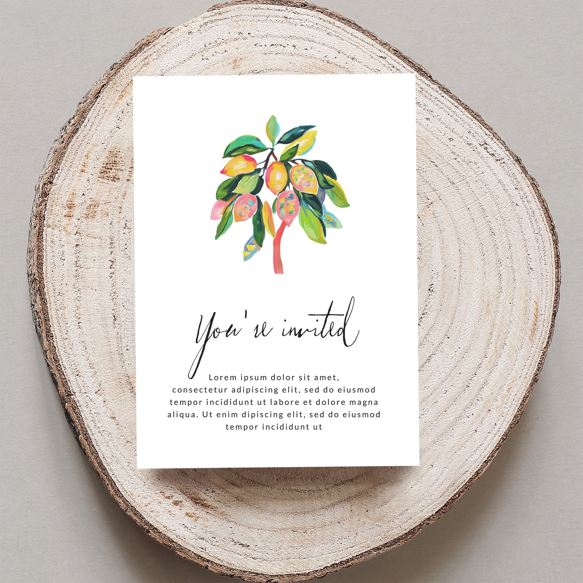 Invitation with watercolor lemon branch and "You're invited" text.