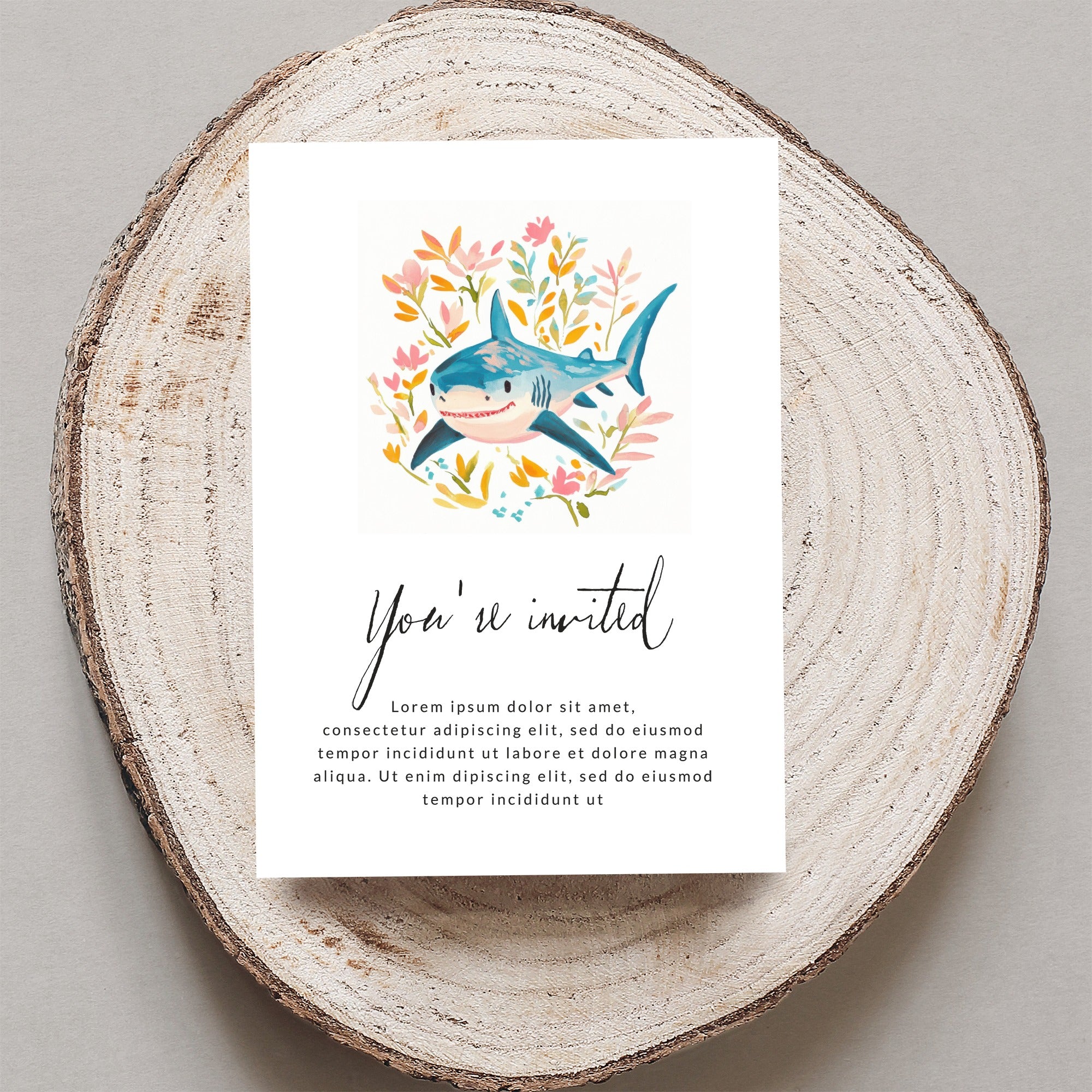 Card with shark and flowers, reads "You're invited" with placeholder text.