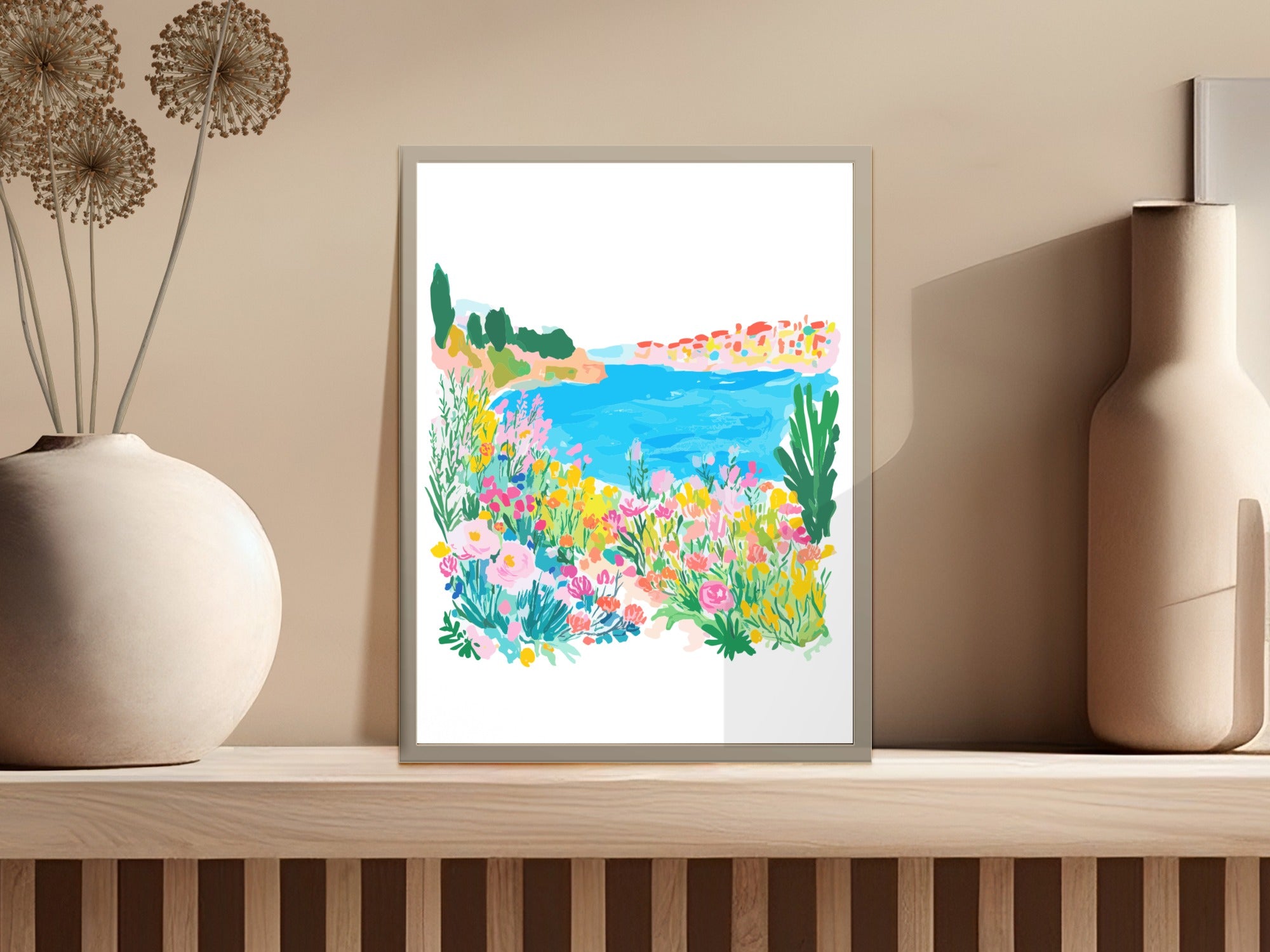 Colorful floral landscape art print of a coastal village with blue water.