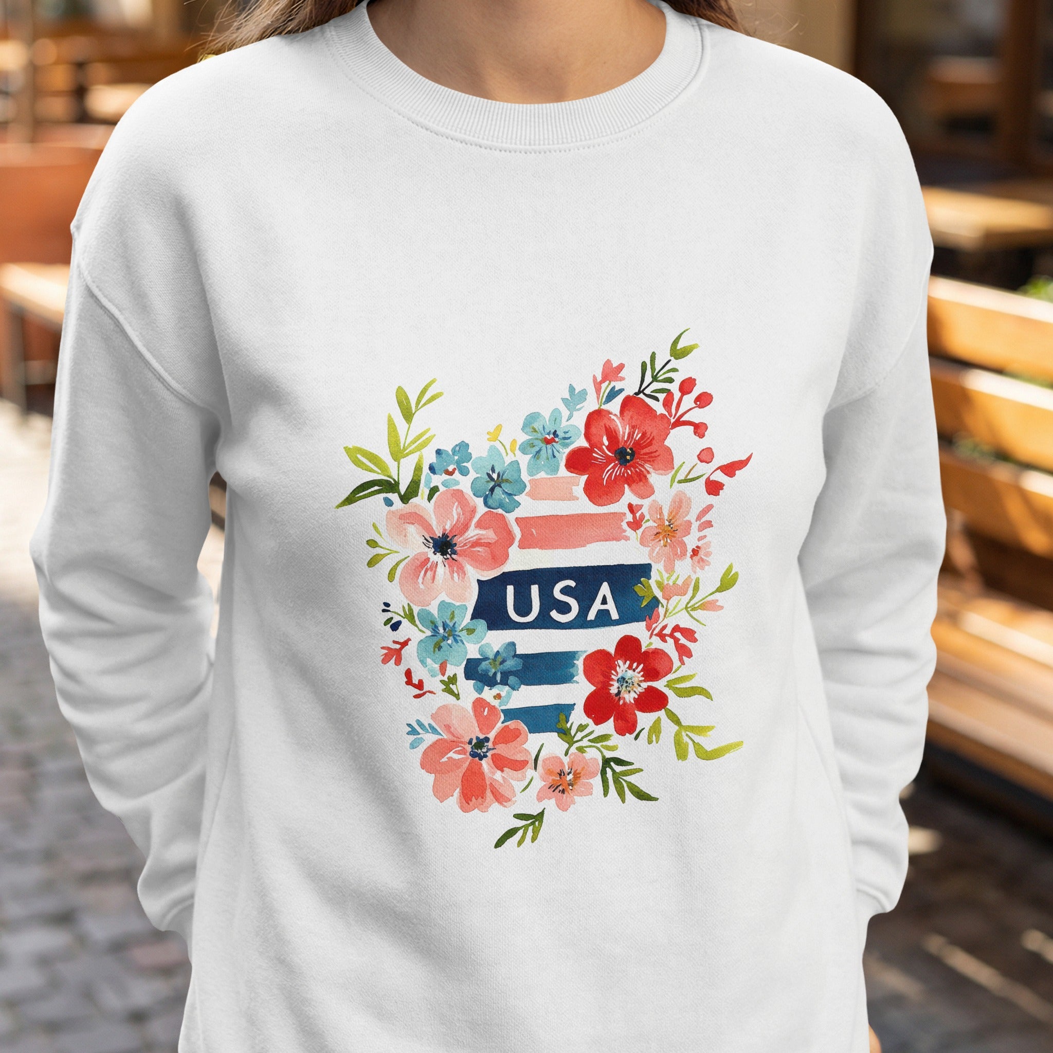White sweatshirt with floral watercolor USA design.