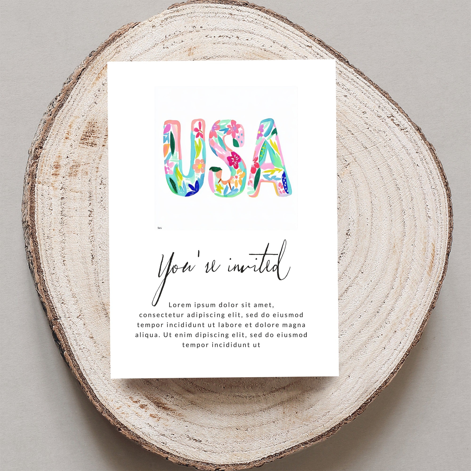 "USA" in floral lettering on an invitation with "You're invited" text.