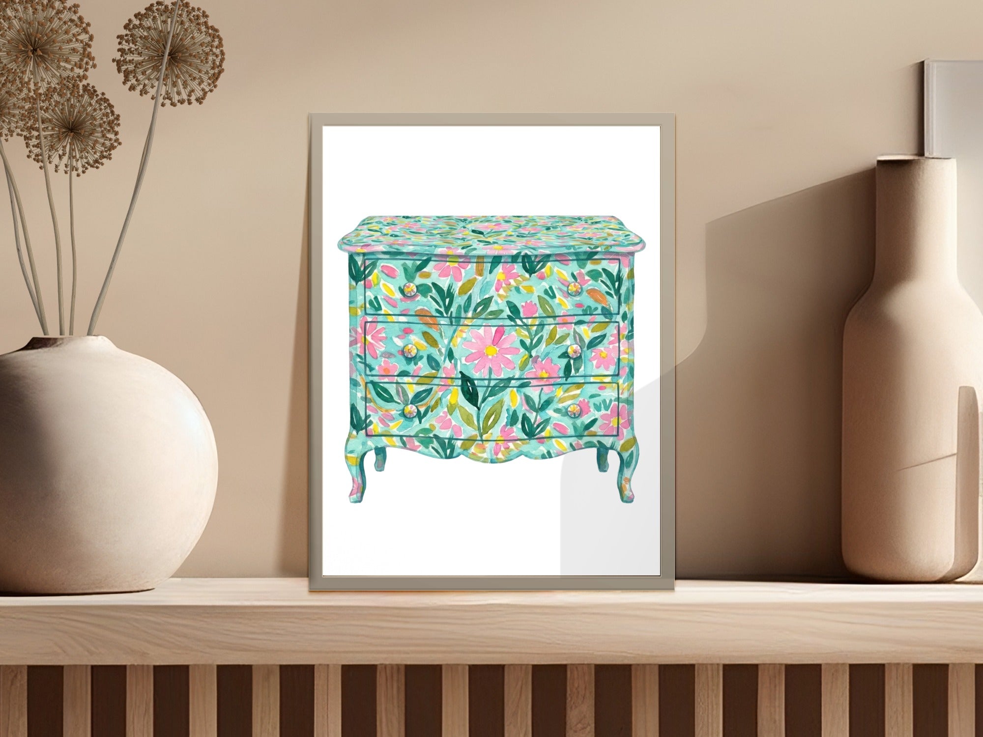 Floral painted dresser with three drawers displayed on a shelf.