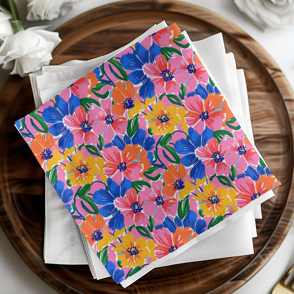 Colorful floral pattern napkins on a wooden platter.