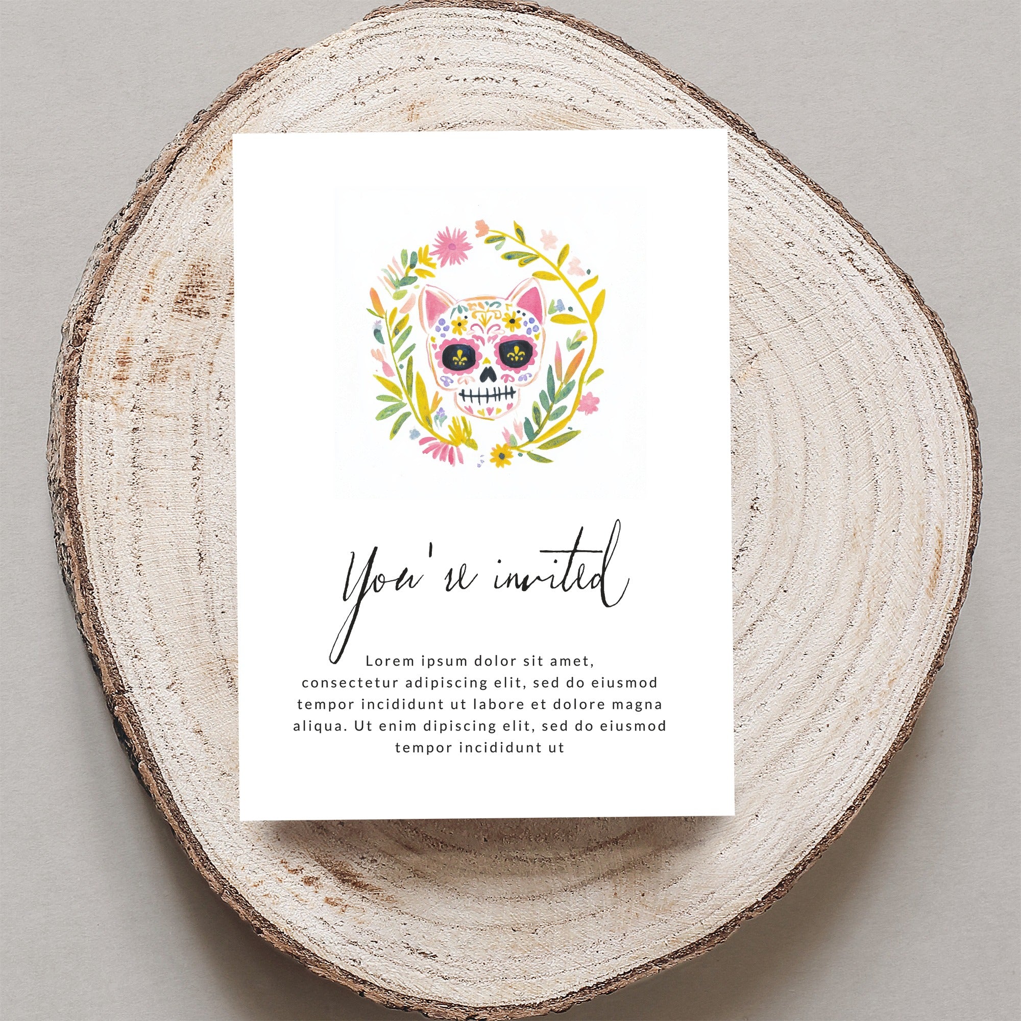 Day of the Dead skull invitation with floral border, "You're invited" text.