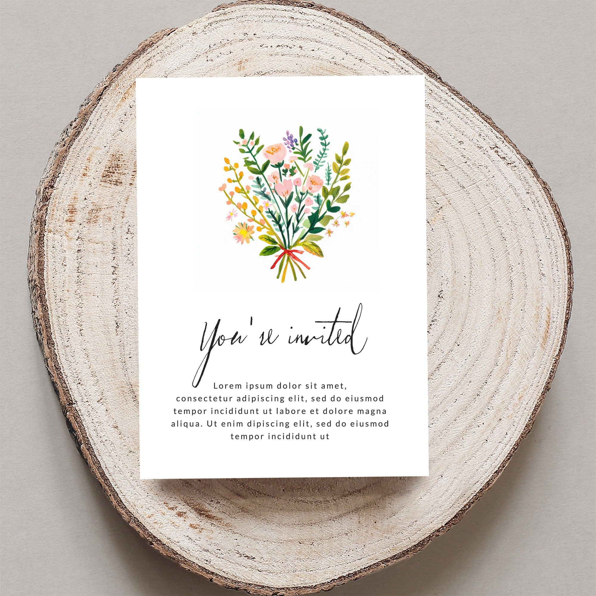 Invitation with floral bouquet and "You're invited" text.