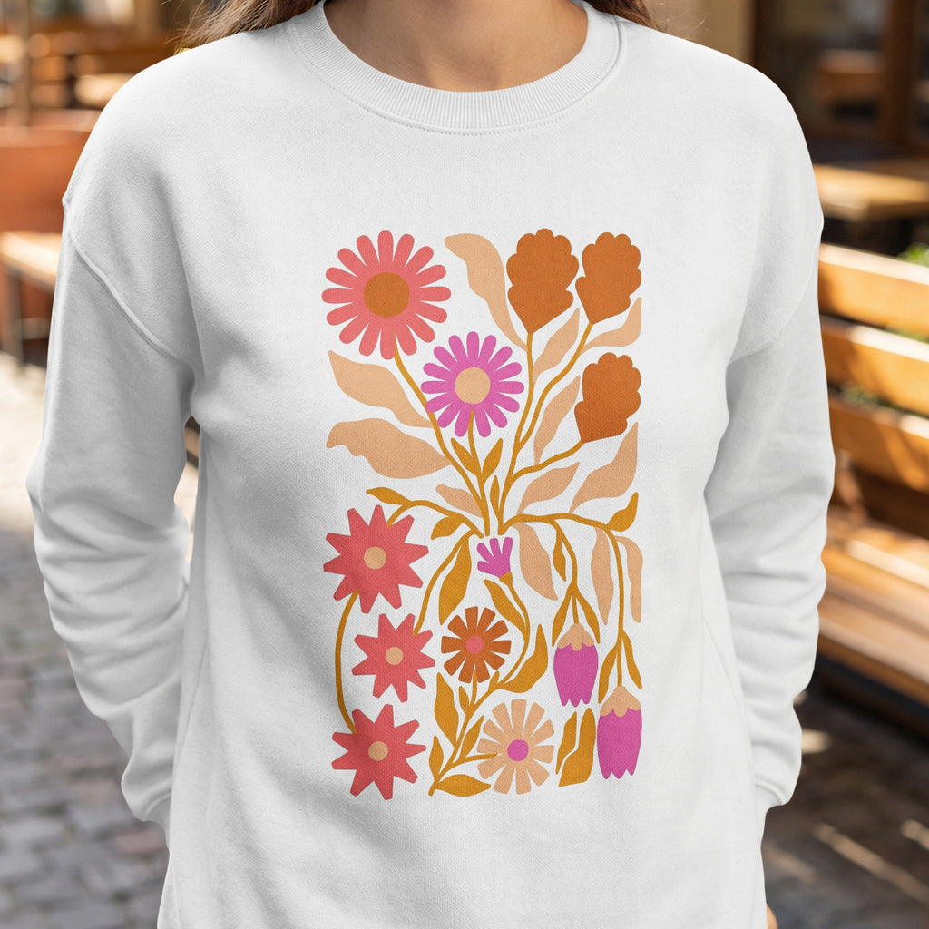 White sweatshirt with a colorful floral illustration featuring pink and orange flowers.