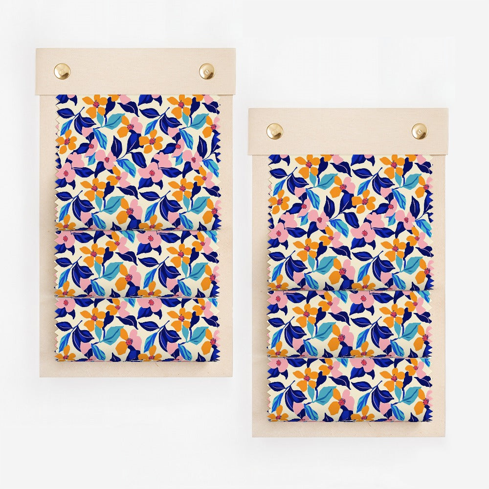 Fabric swatches with a blue, pink, and orange floral pattern.