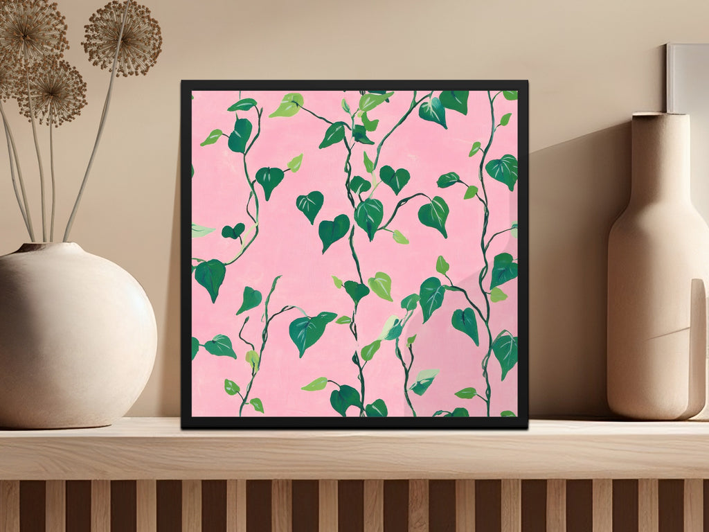 Green vine leaves with pink background in a square frame.