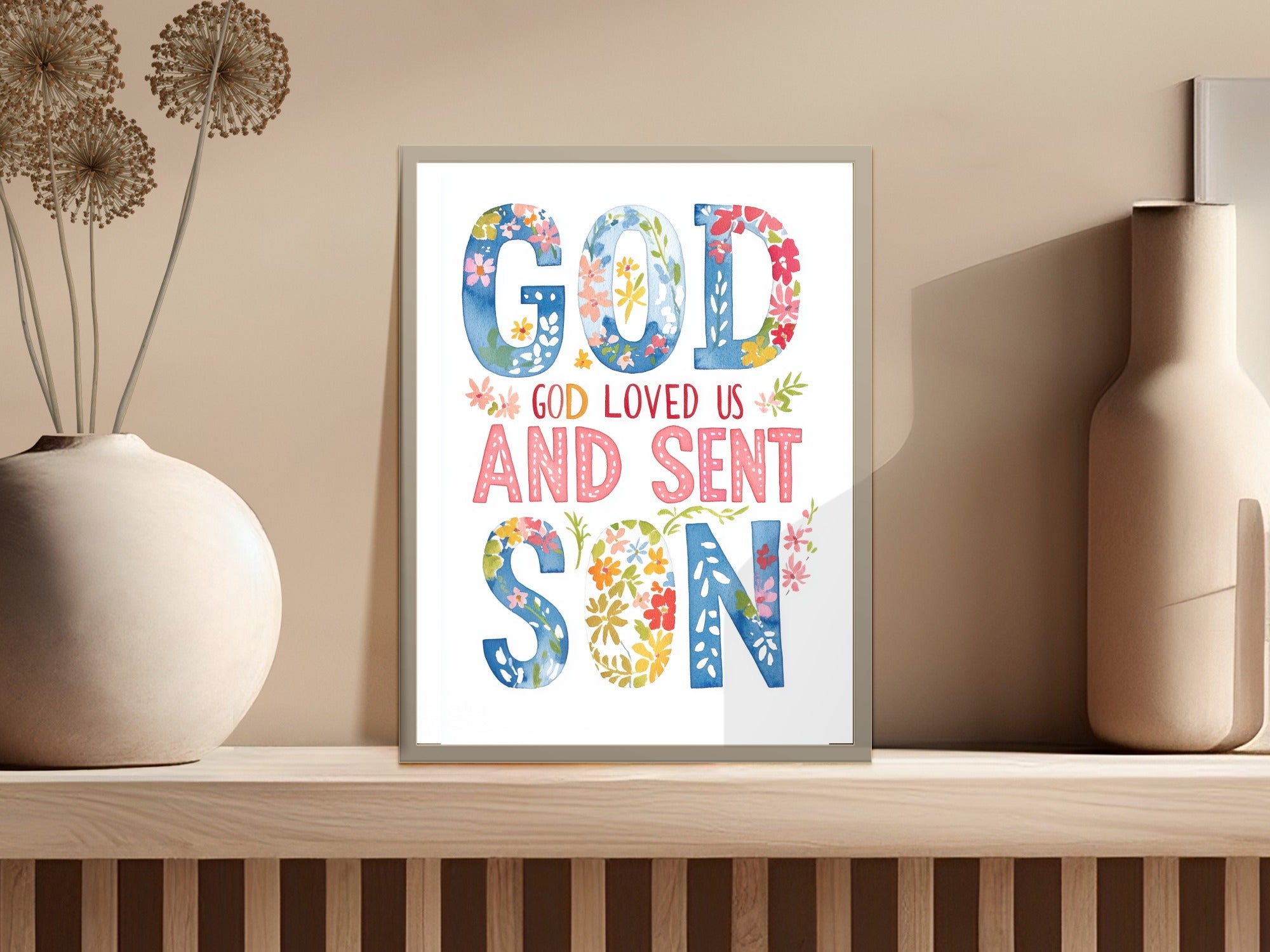 "God Loved Us And Sent His Son" religious art print with floral accents.