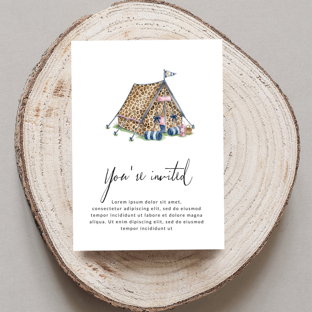 Invitation with a leopard-print tent and camping gear.