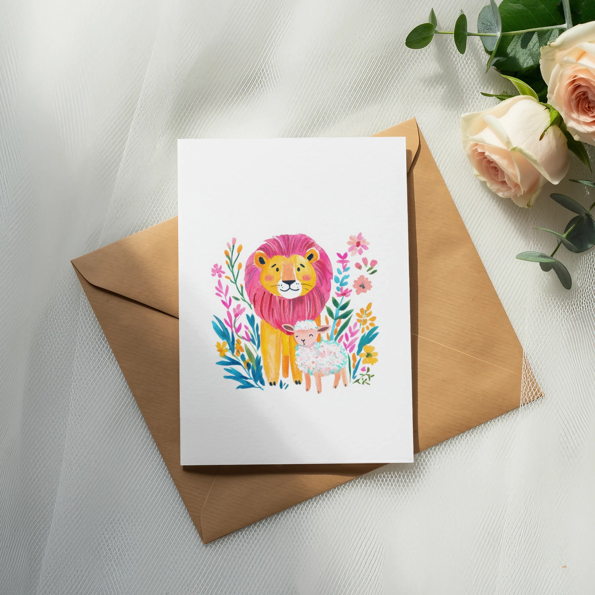 Watercolor illustration of a lion and lamb surrounded by flowers on a card.