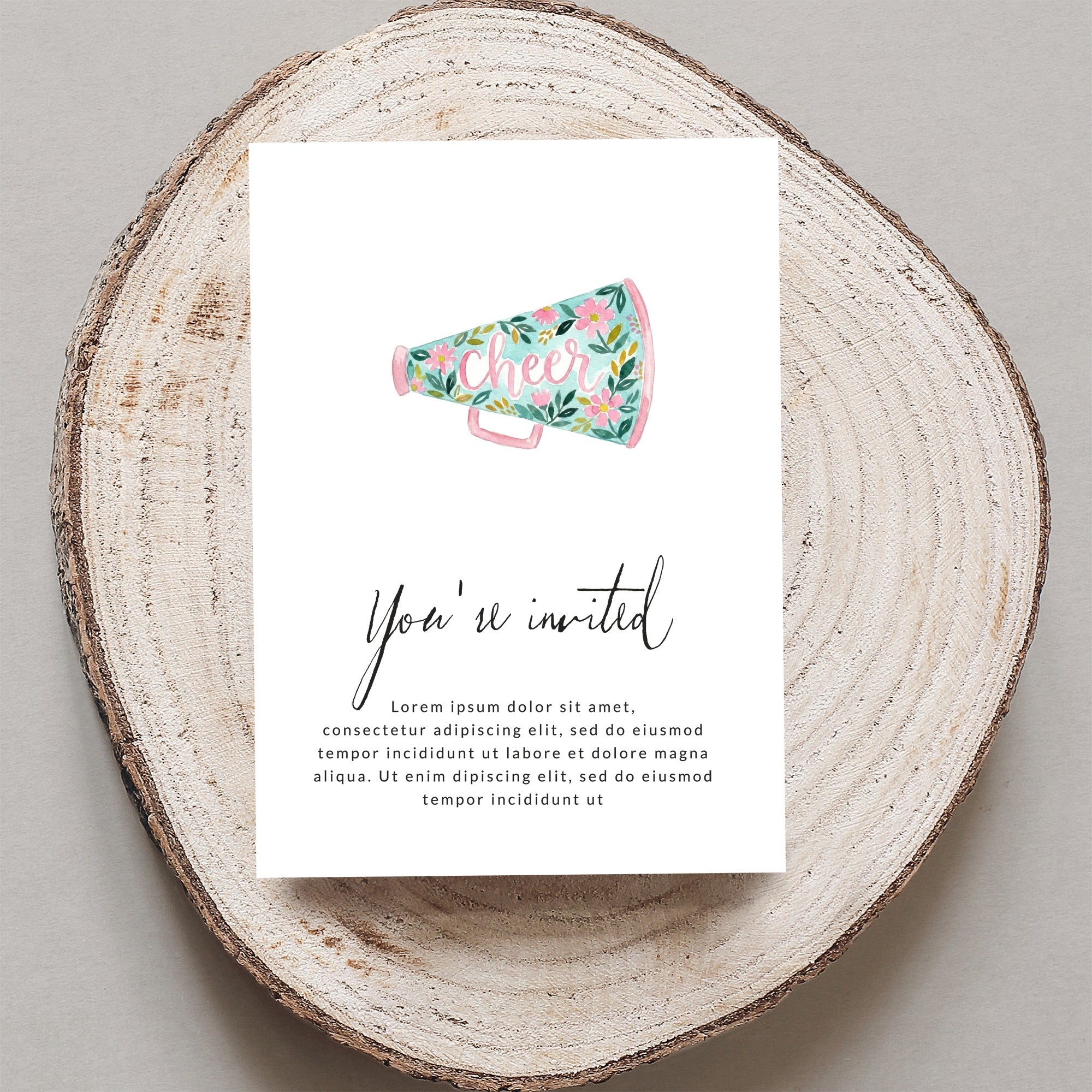 Cheer invitation with floral megaphone and "You're invited" text.