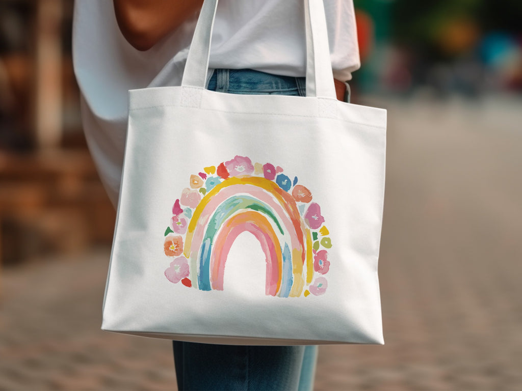 White tote bag with colorful floral rainbow design.