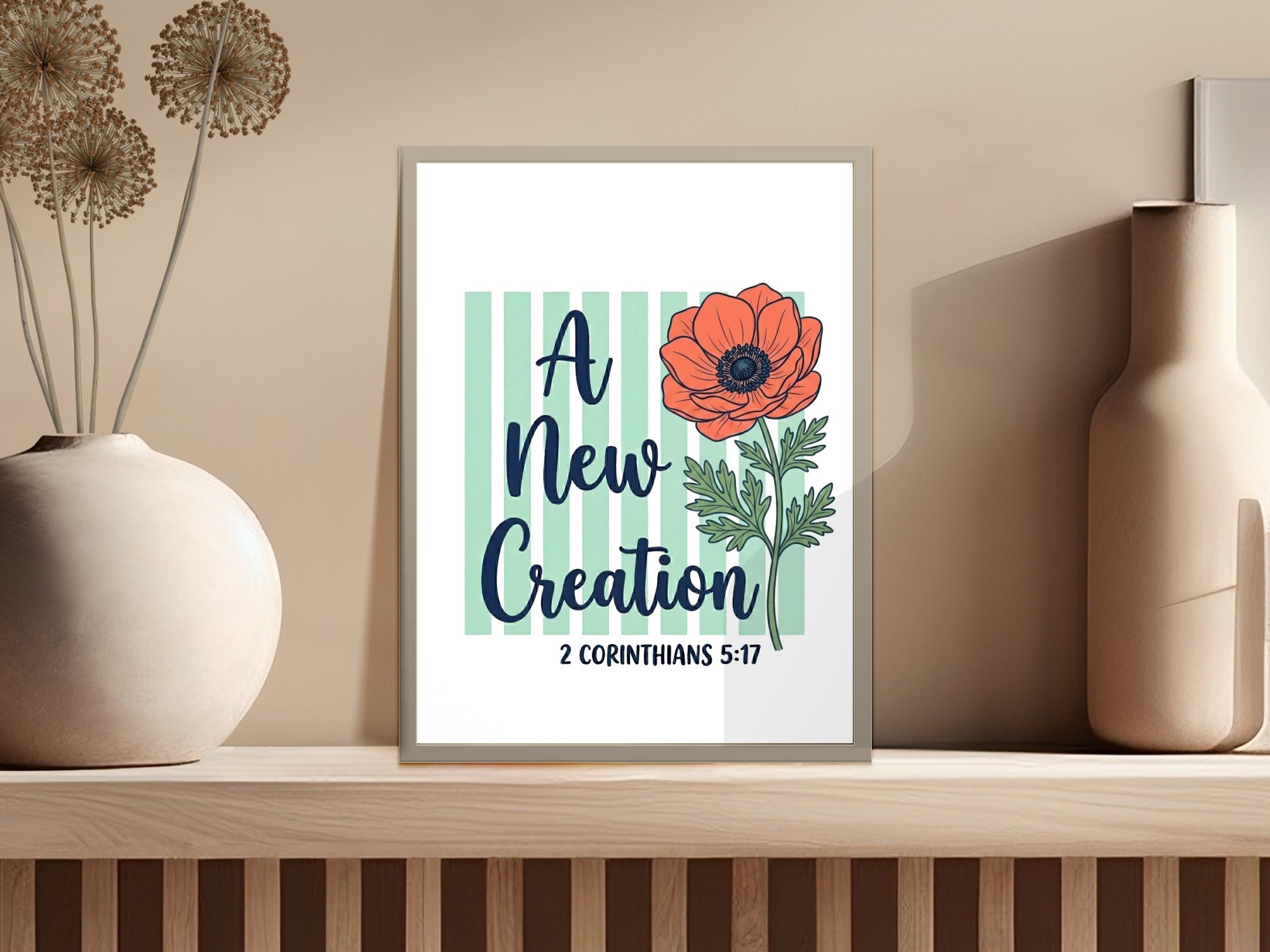 Floral art with "A New Creation" and scripture verse 2 Corinthians 5:17.