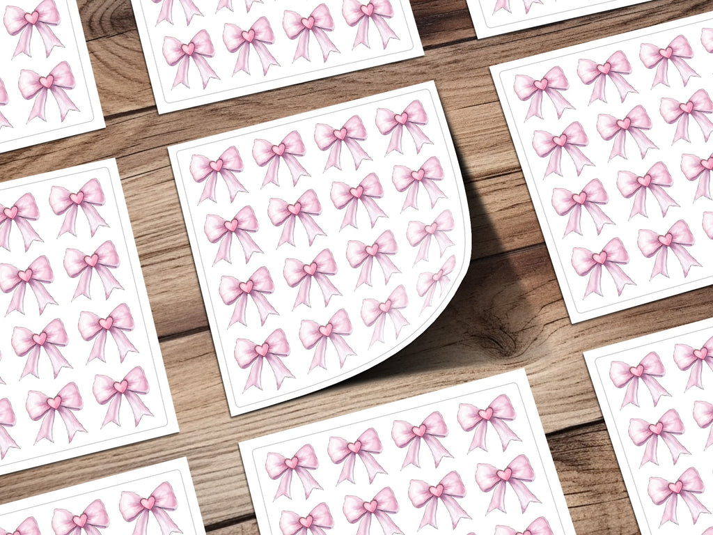 Pink Bow Stickers with Heart Design on White Background