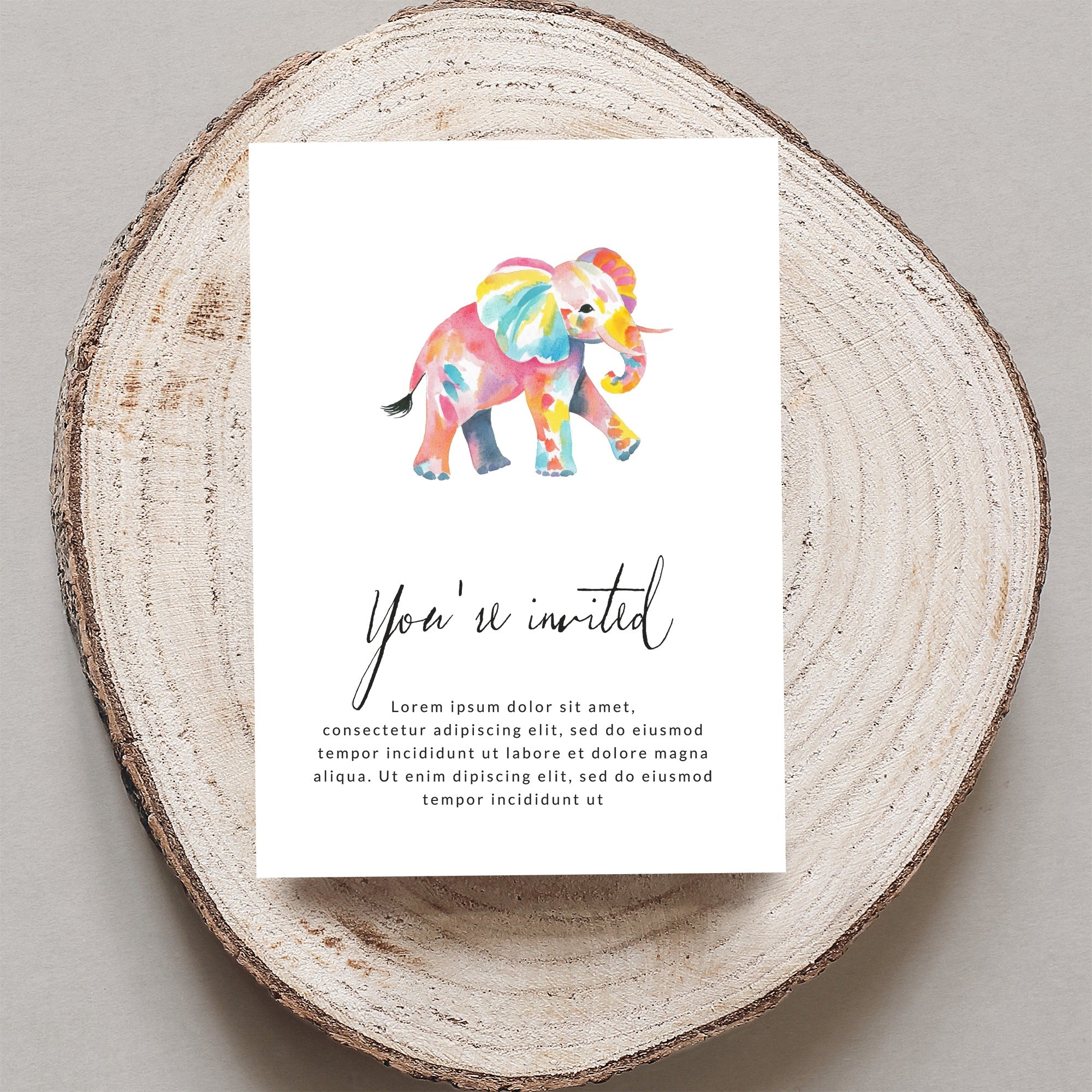 Watercolor invitation card with colorful elephant and placeholder text.