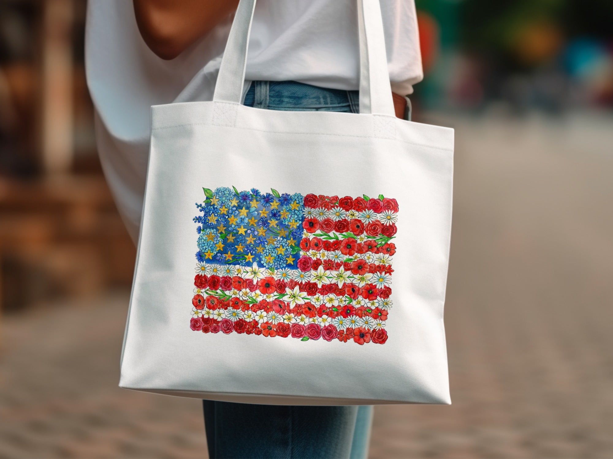 White tote bag with American flag design made of flowers.