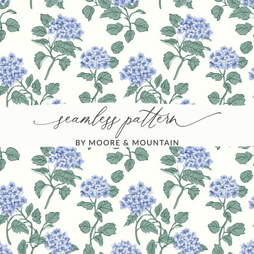 Seamless pattern of blue hydrangeas on a cream background, by Moore & Mountain.