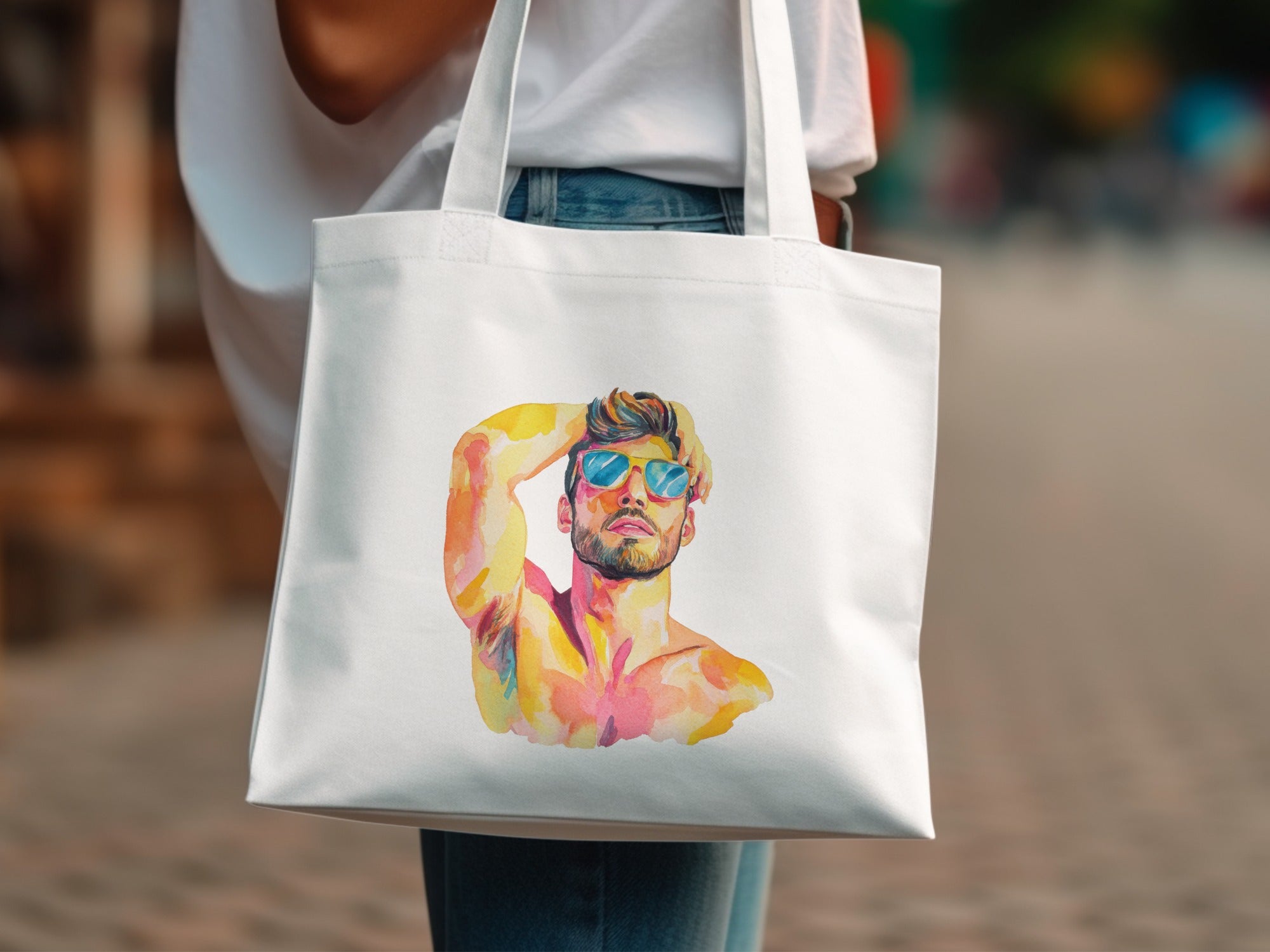 White tote bag with watercolor portrait of a man wearing sunglasses.