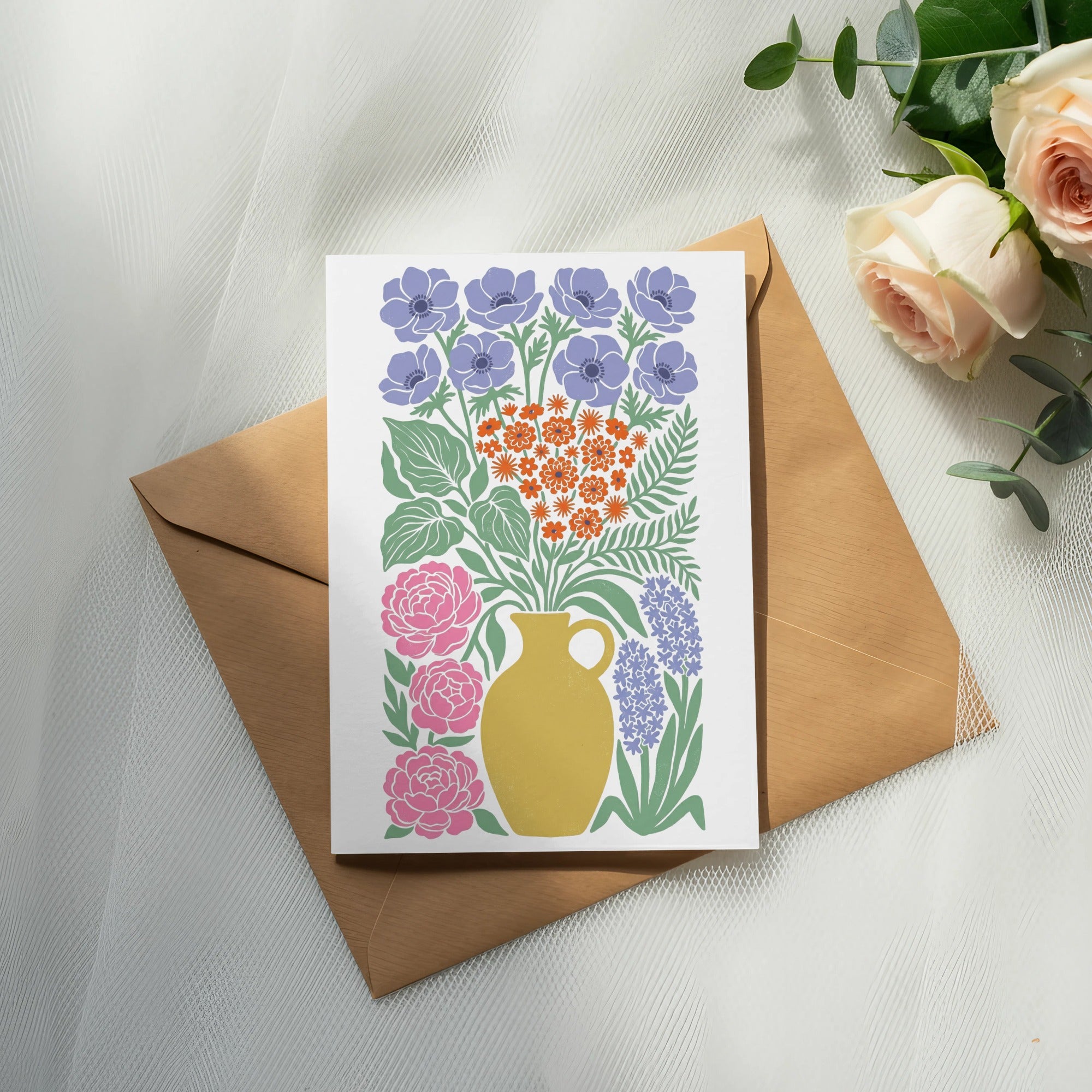 Greeting card with floral illustration on a brown envelope.