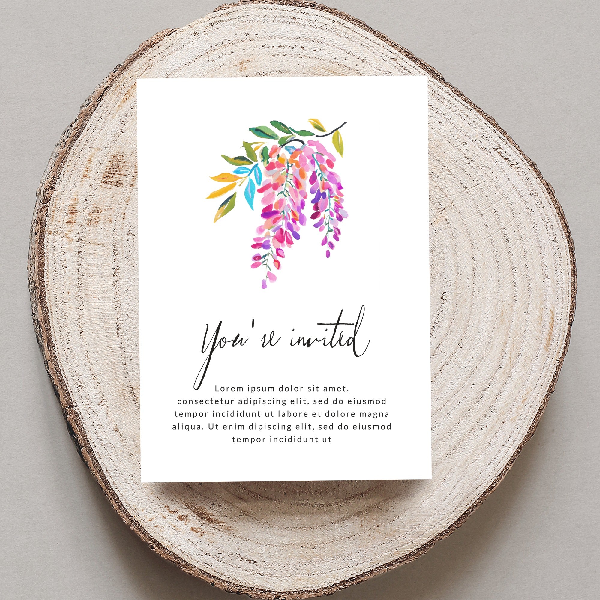Invitation with watercolor wisteria art and "You're invited" text.