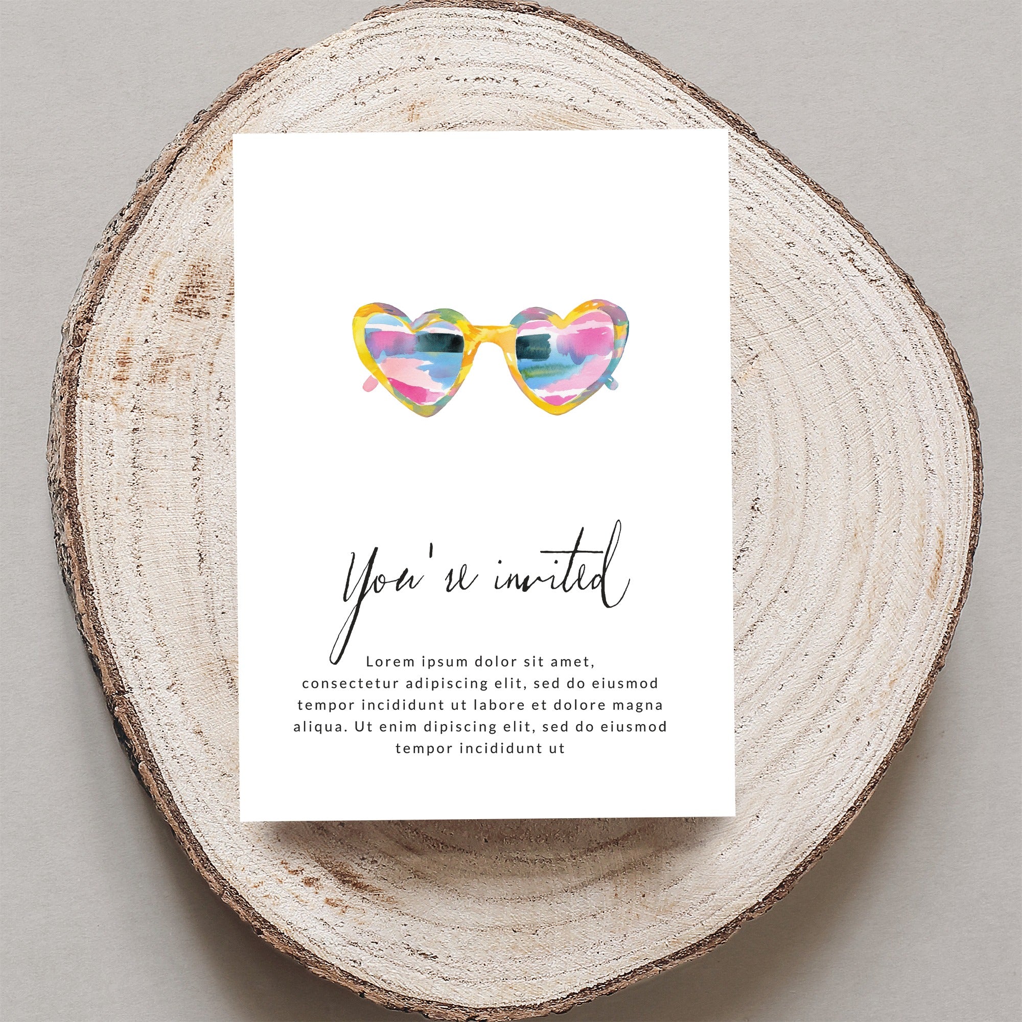 Invitation with colorful heart sunglasses and "You're invited" text.