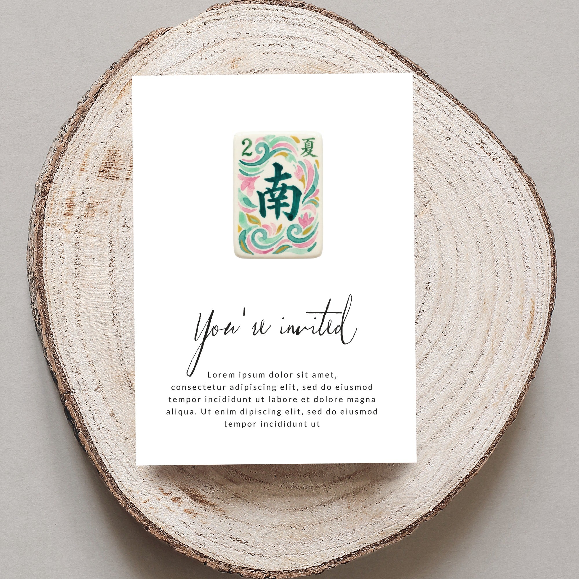 Mahjong tile "South" and "Summer" on an invitation with "You're invited" text.