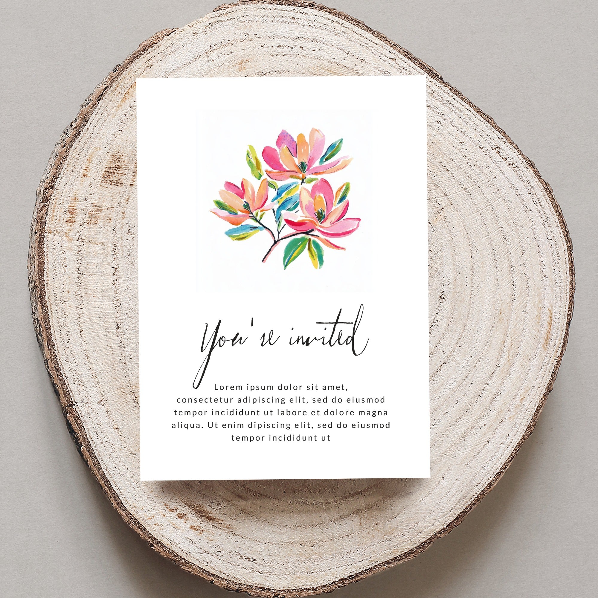 Invitation card with watercolor flowers and "You're invited" text.
