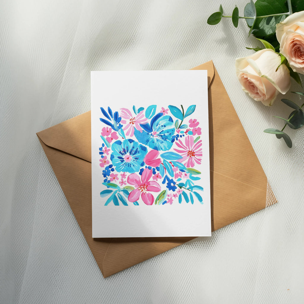 Watercolor floral greeting card on brown envelope, with roses and eucalyptus.