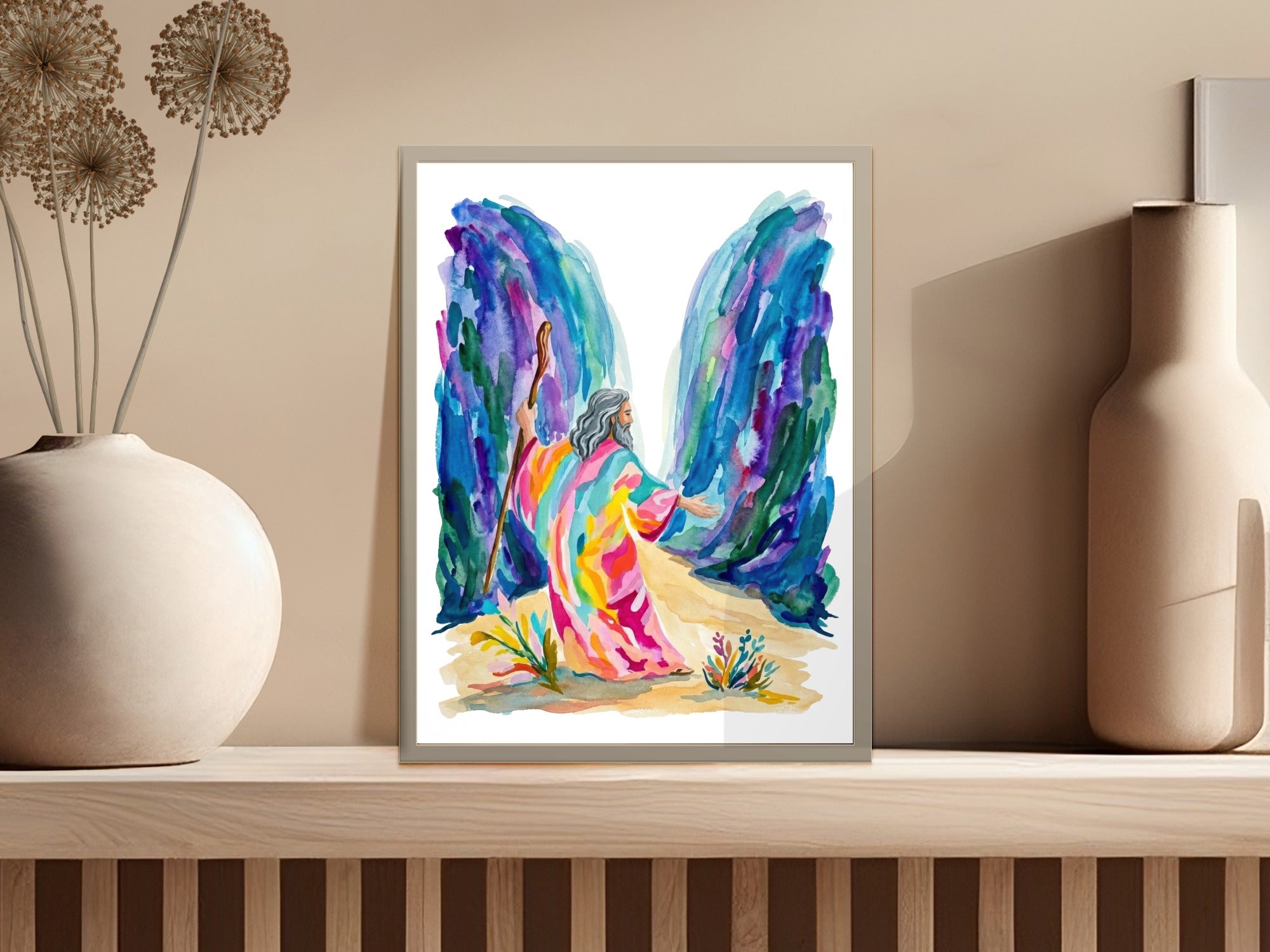 A colorful figure in a robe walks between vibrant blue and purple rock formations.