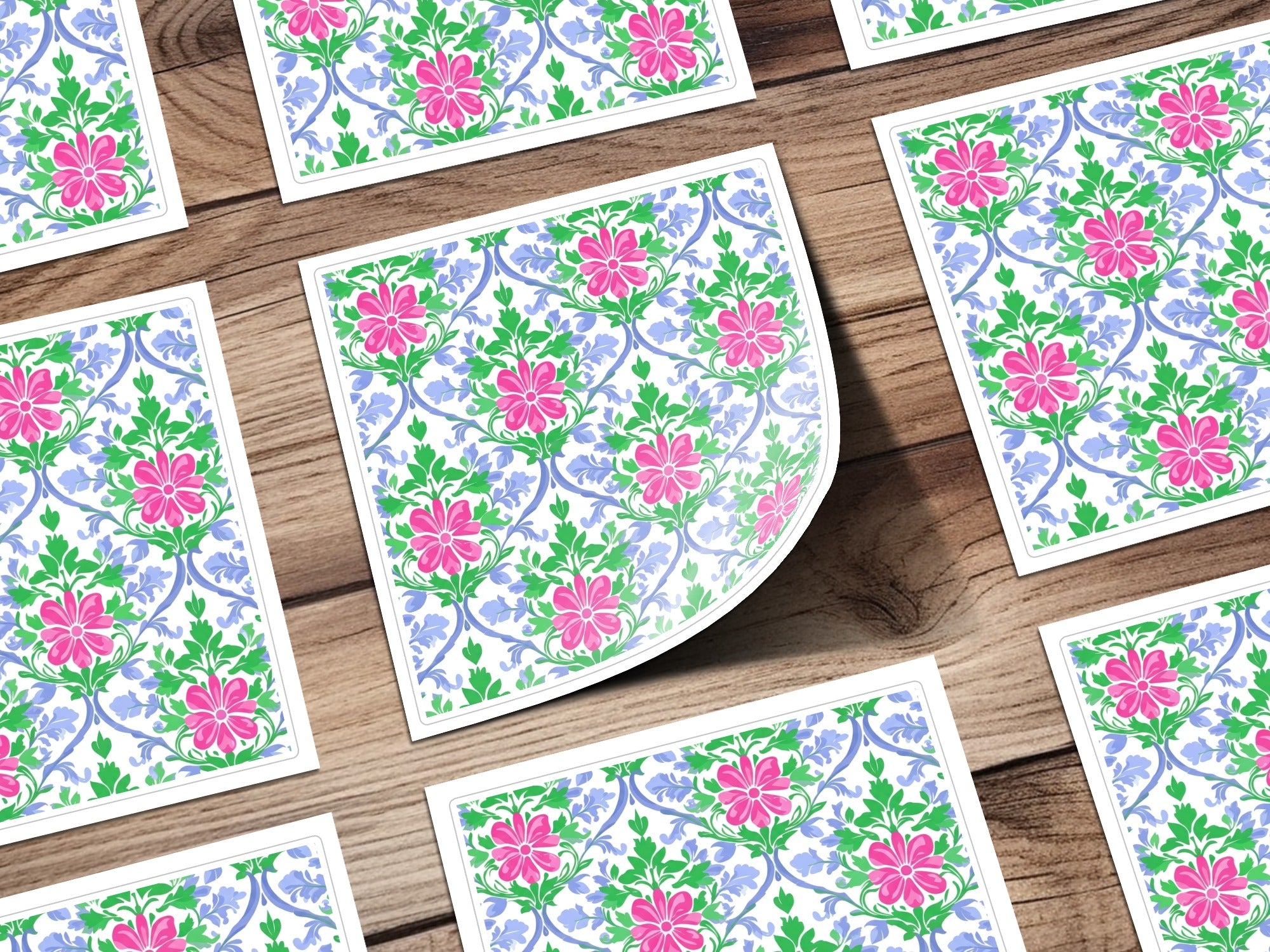 Floral pattern with pink flowers and blue vines on white cards.