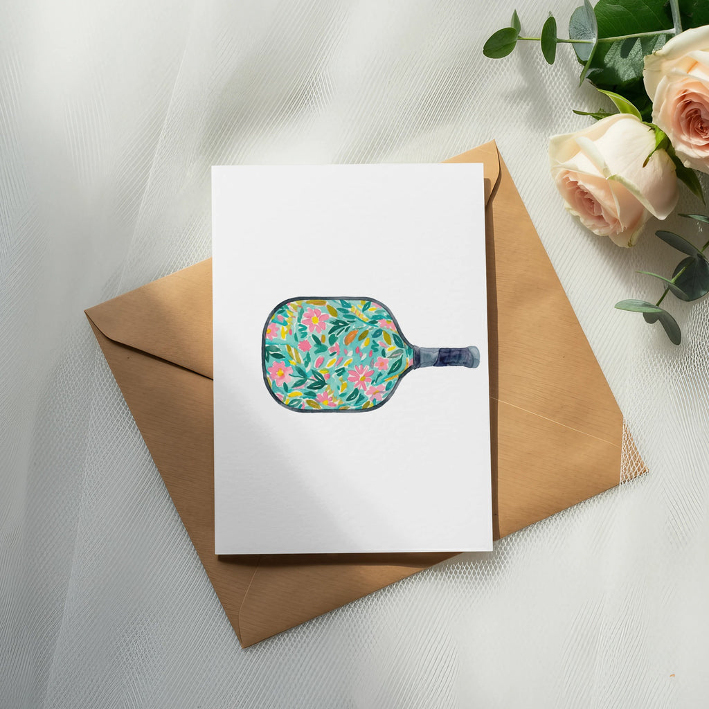White card on brown envelope with pickleball paddle design.