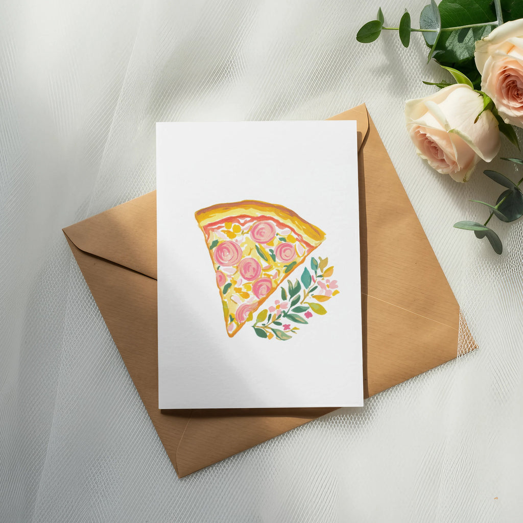 Watercolor slice of pizza with flowers on card over brown envelope.