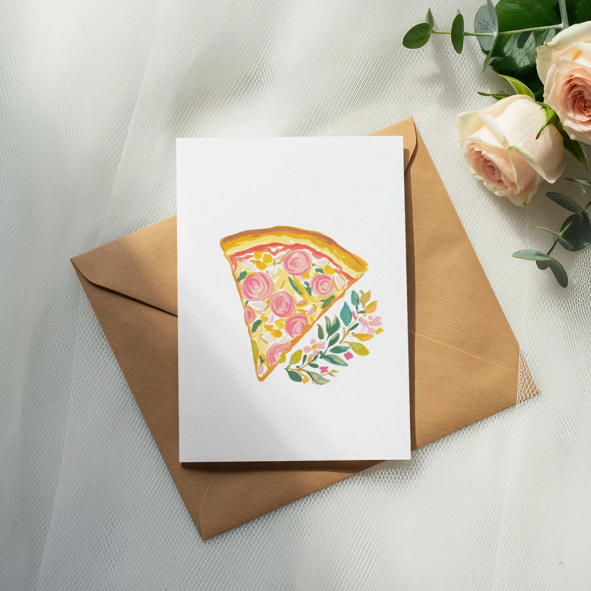 Watercolor slice of pizza with flowers on card over brown envelope.